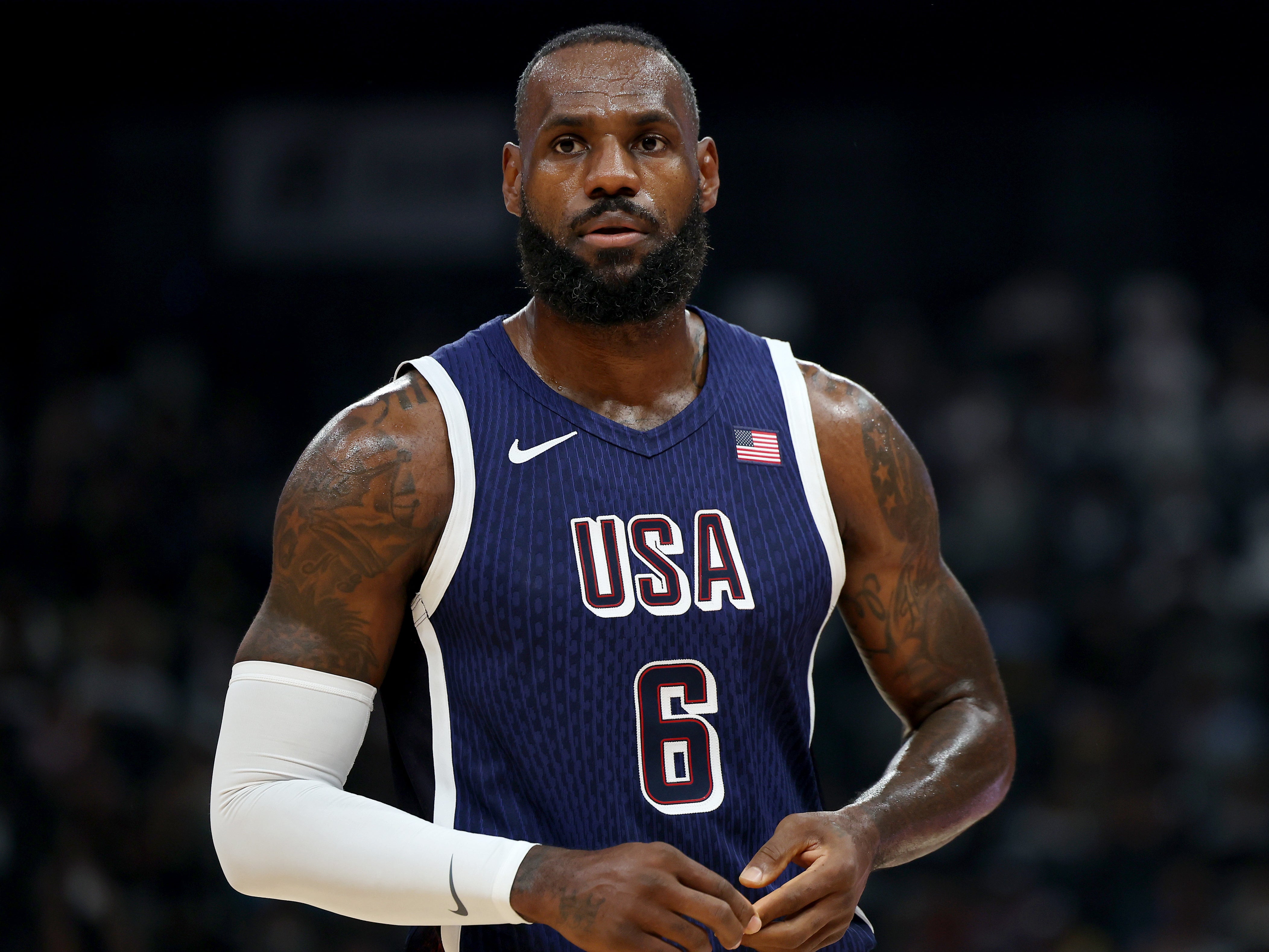 LeBron James was selected by fellow basketball star Stephen Curry to carry the star-spangled banner at the Paris Games