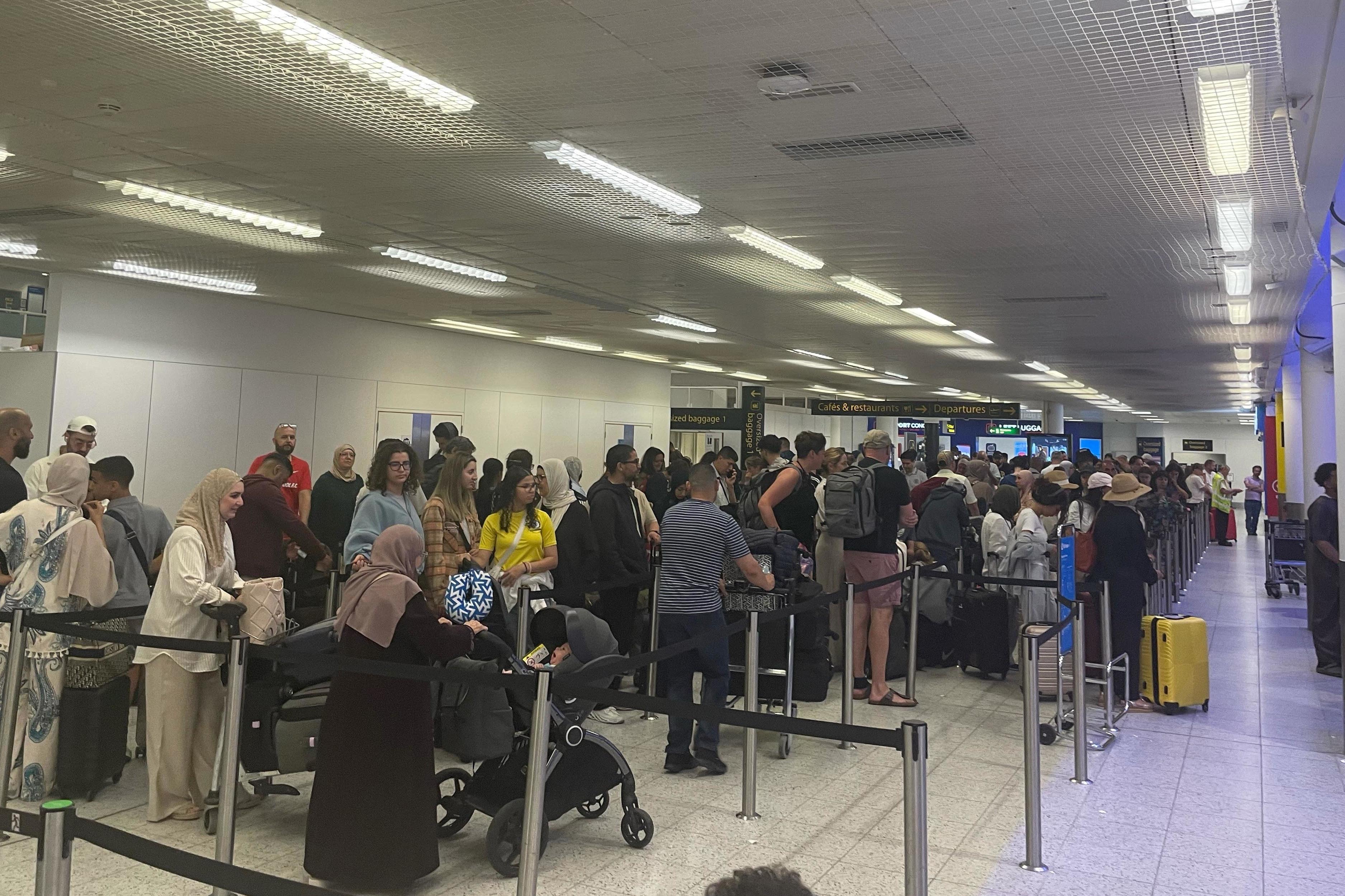 Passengers at Gatwick Airport as airlines continued to deal with the fallout from the global IT outage (Luke O’Reilly/PA)