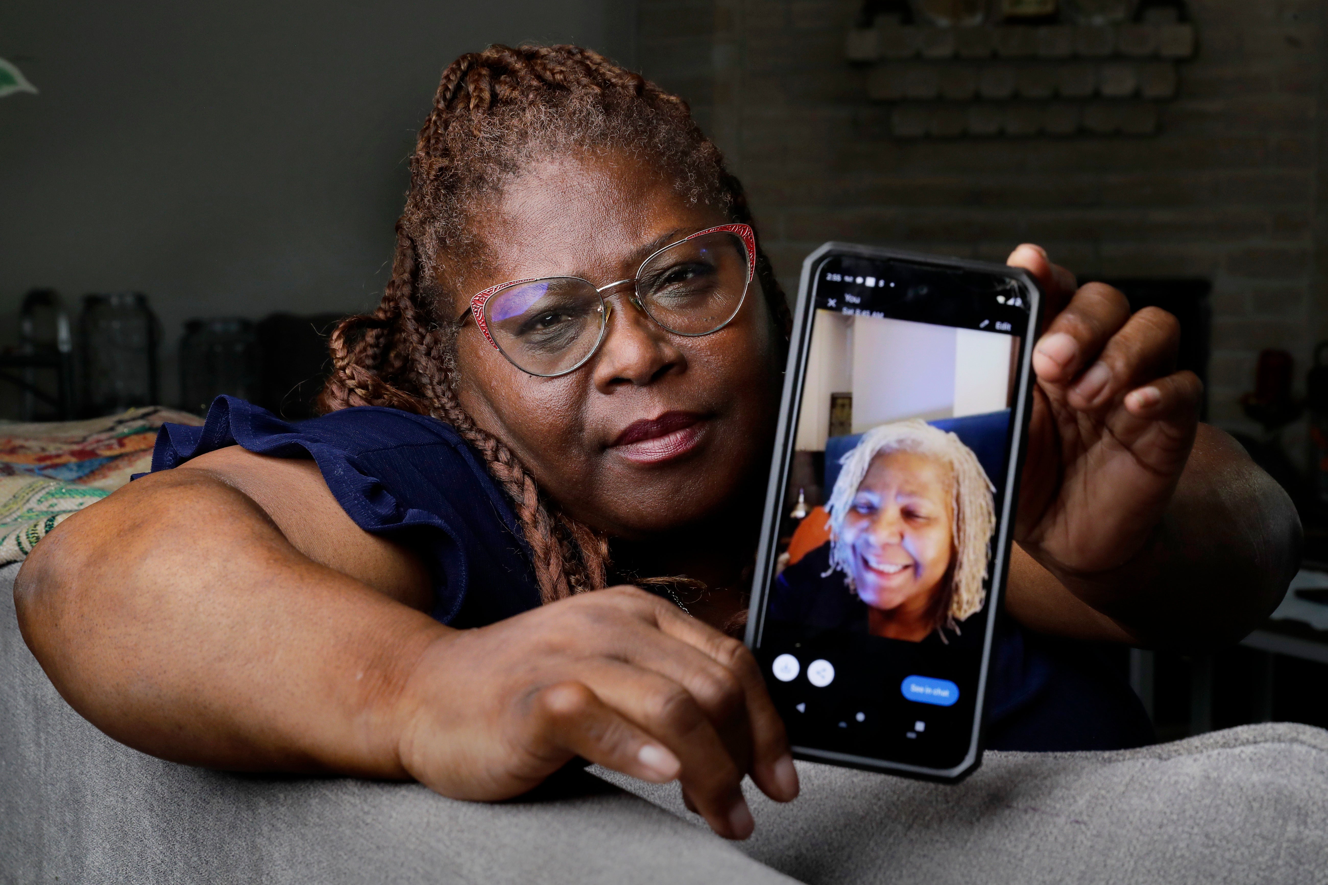 Janet Jarrett shows a photo of her sister, Pamela Jarrett, in Spring, Texas. Pamela Jarrett died after suffering heat-related distress due to the power outage caused by Hurricane Beryl