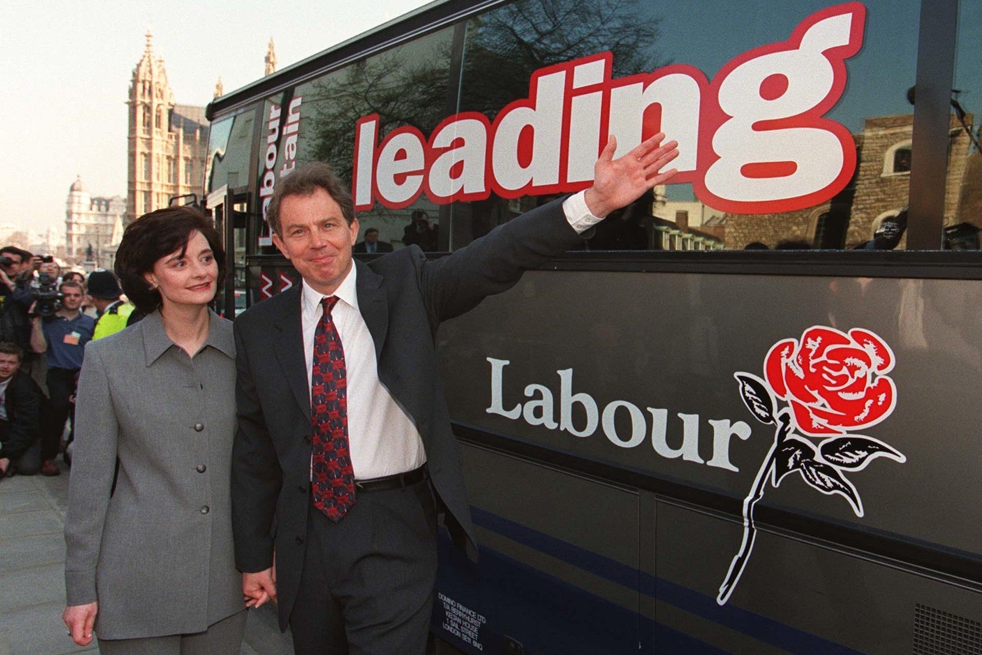 Tony Blair with his wife, Cherie, alongside Labour’s 1997 general election battle bus (Sean Dempsey/PA)