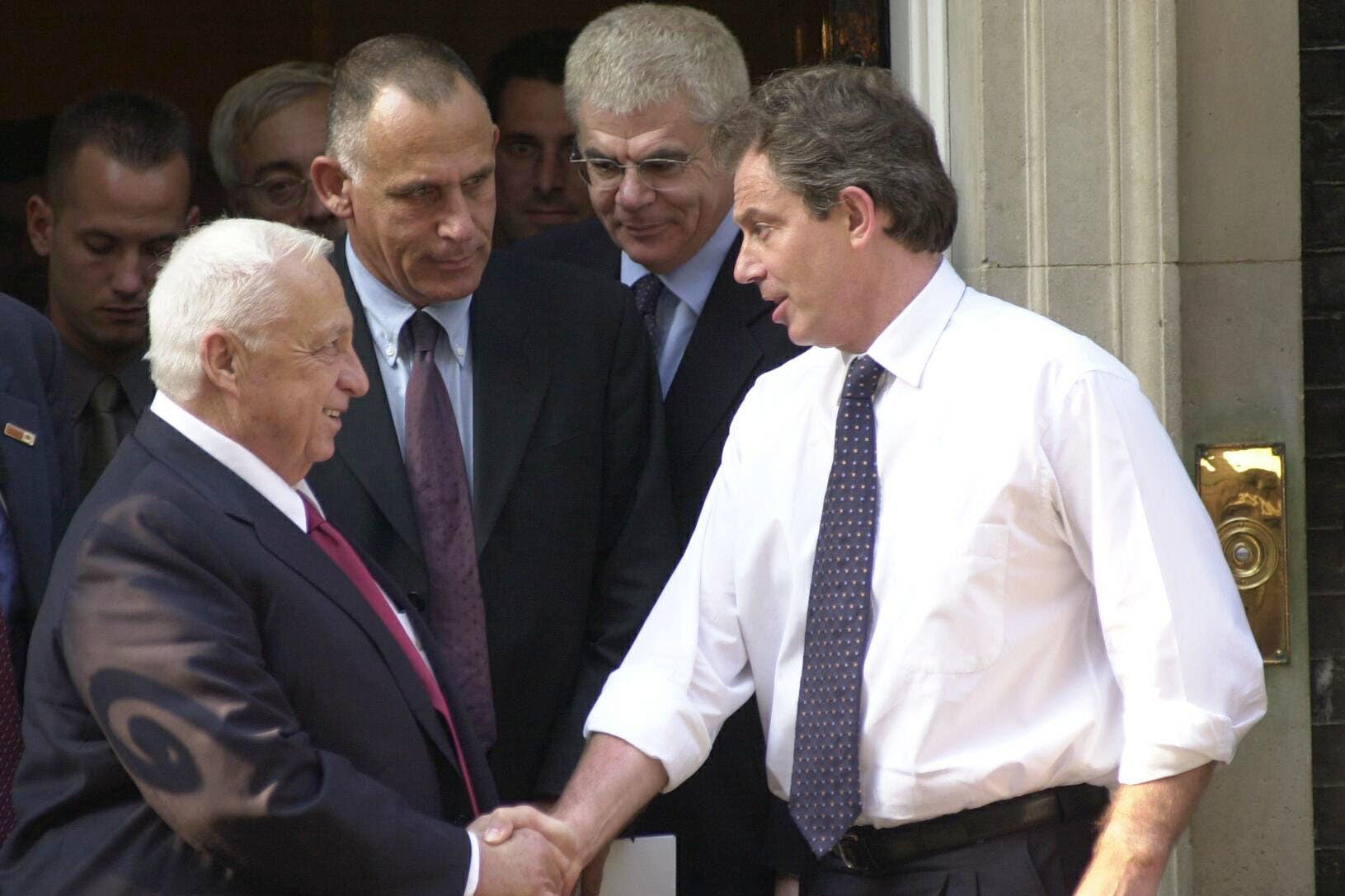 Tony Blair shakes hands with Ariel Sharon (Toby Melville/PA)