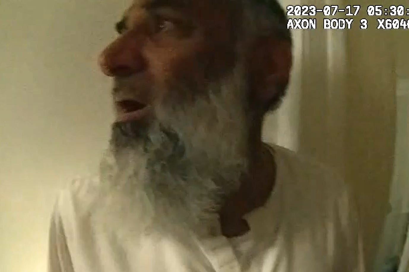 Anjem Choudary appeared visibly shocked after officers entered the property (Metropolitan Police/PA)