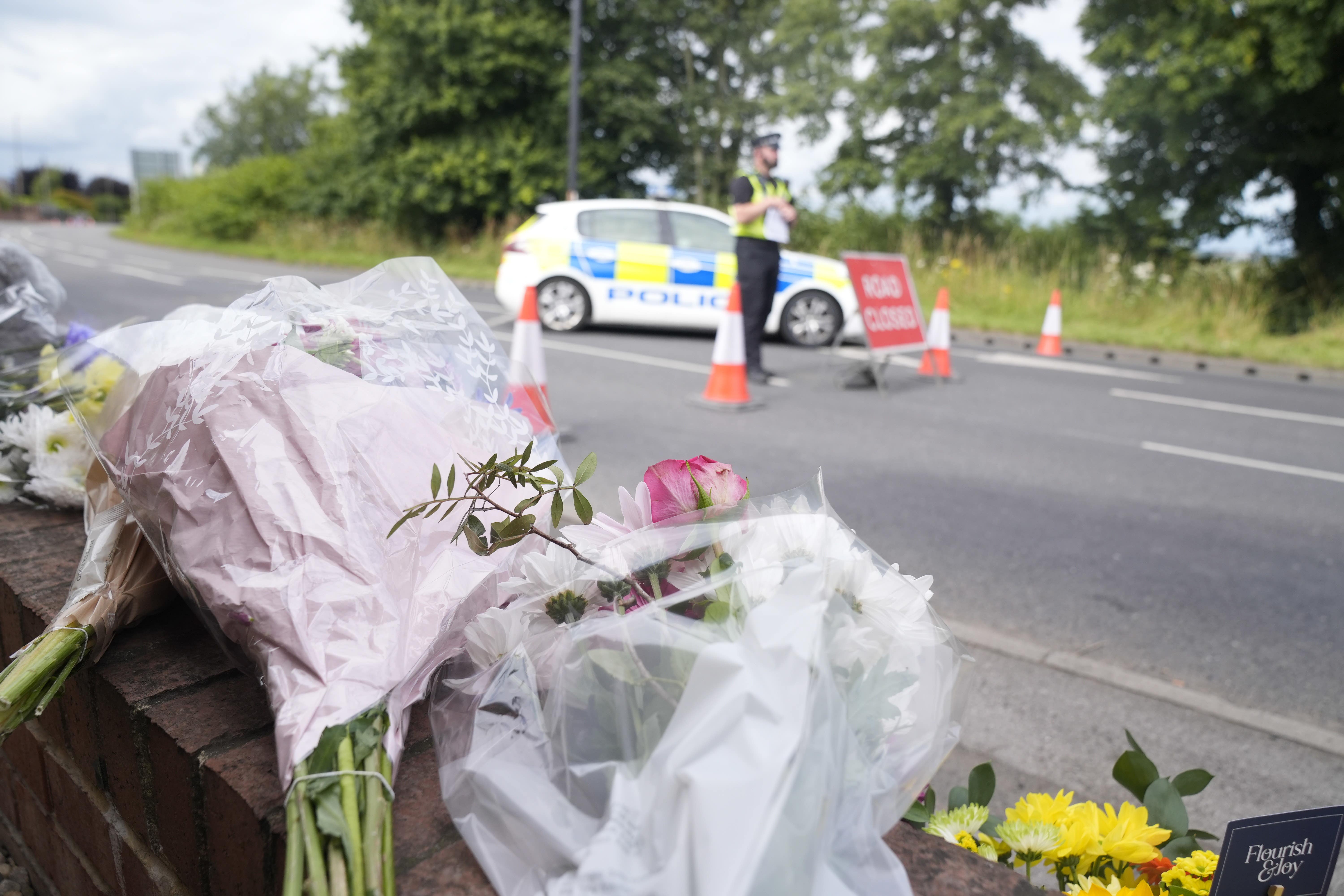 Flowers and tributes laid near the scene on the A61 in Wakefield