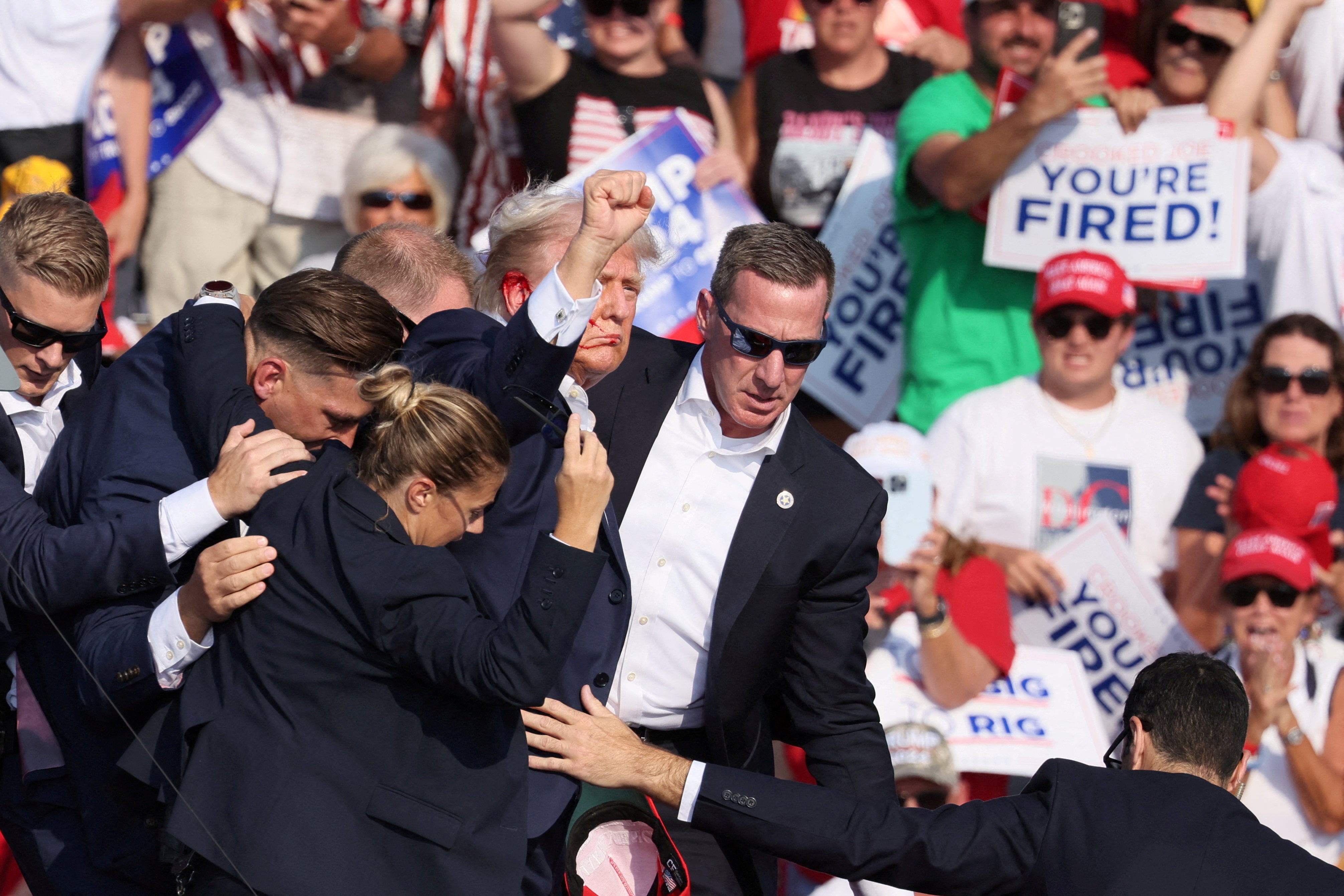 Donald Trump’s Secret Service detail covers the former president after shots were fired during a campaign rally in Pennsylvania on July 13