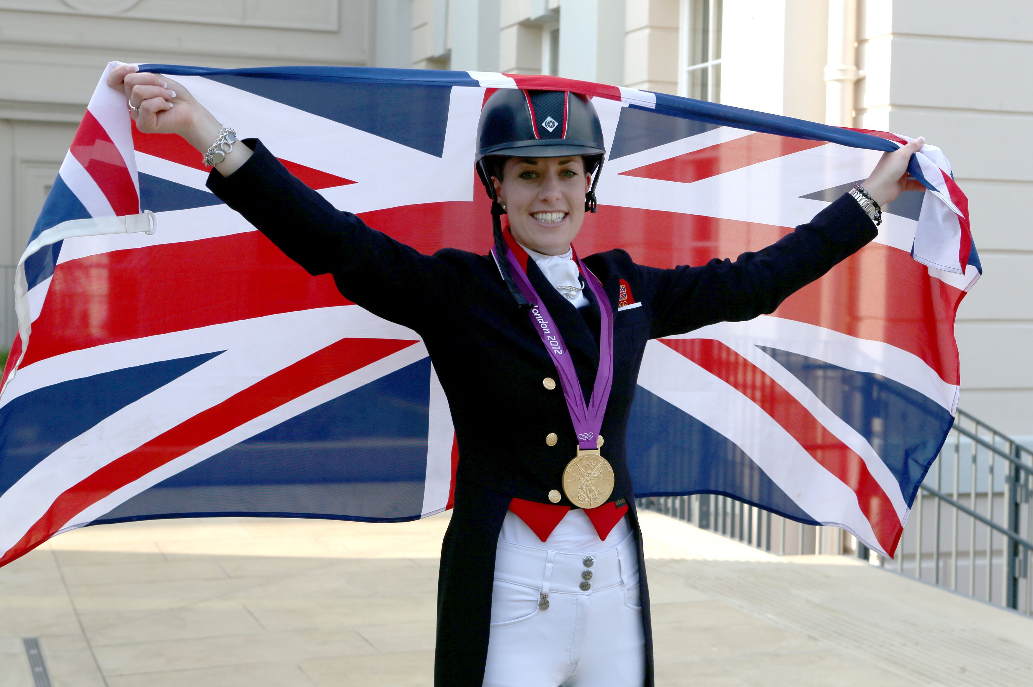 Charlotte Dujardin celebrating after winning gold in London (Steve Parsons, PA)