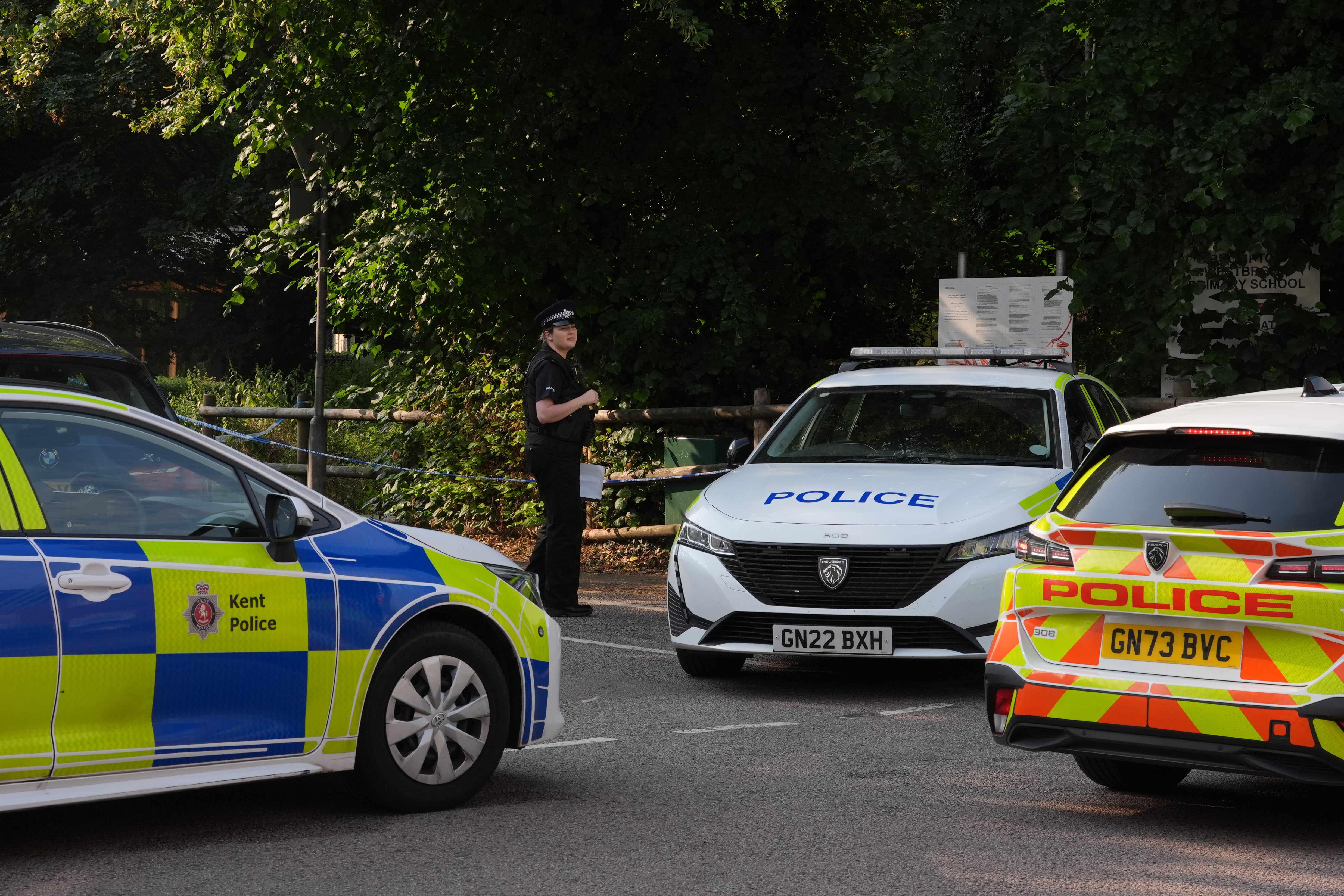 Police vehicles beside a cordon at the scene in Gillingham on Wednesday