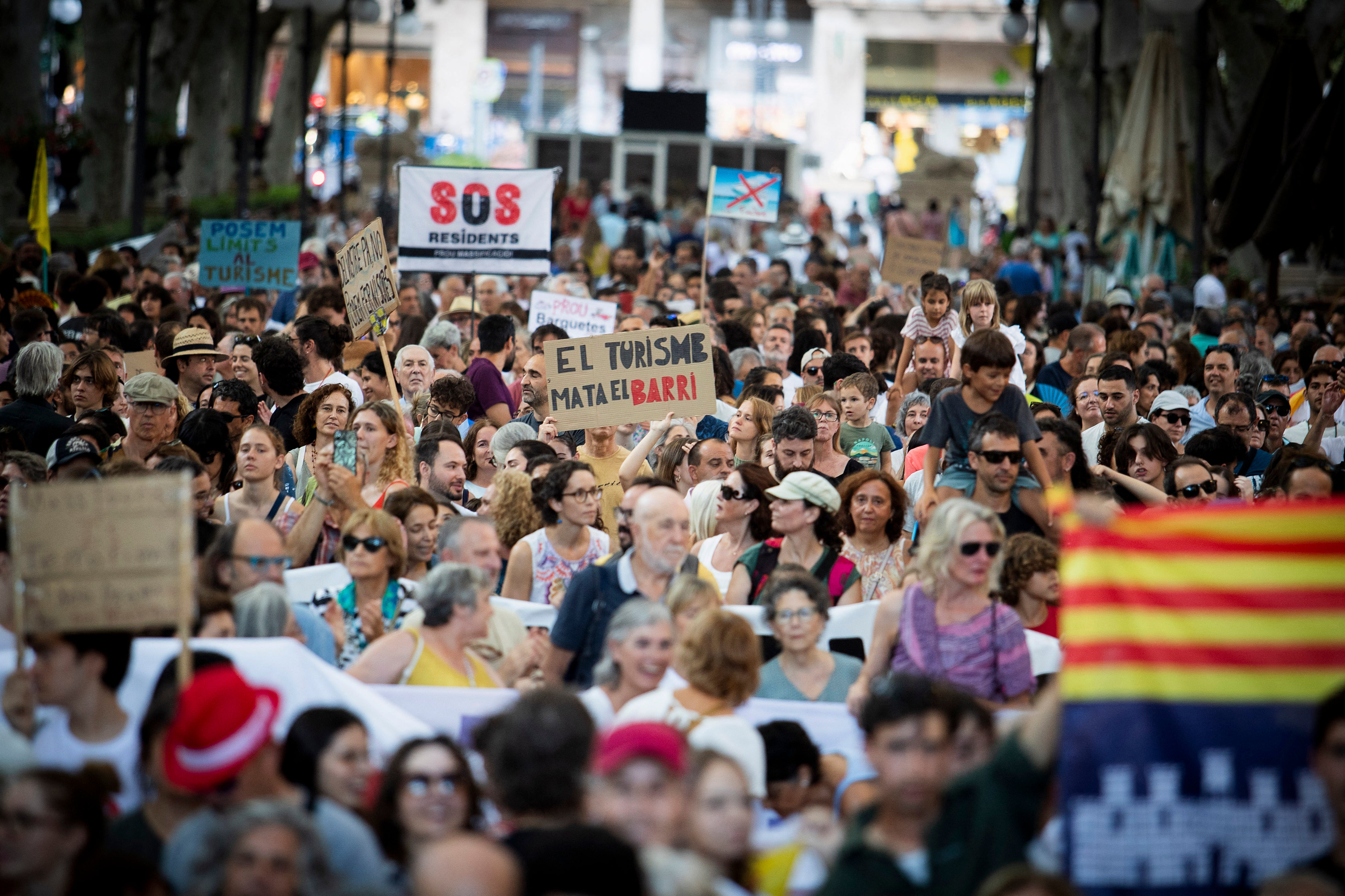 People take part in a demonstration to protest against overtourism and housing prices on the island of Mallorca