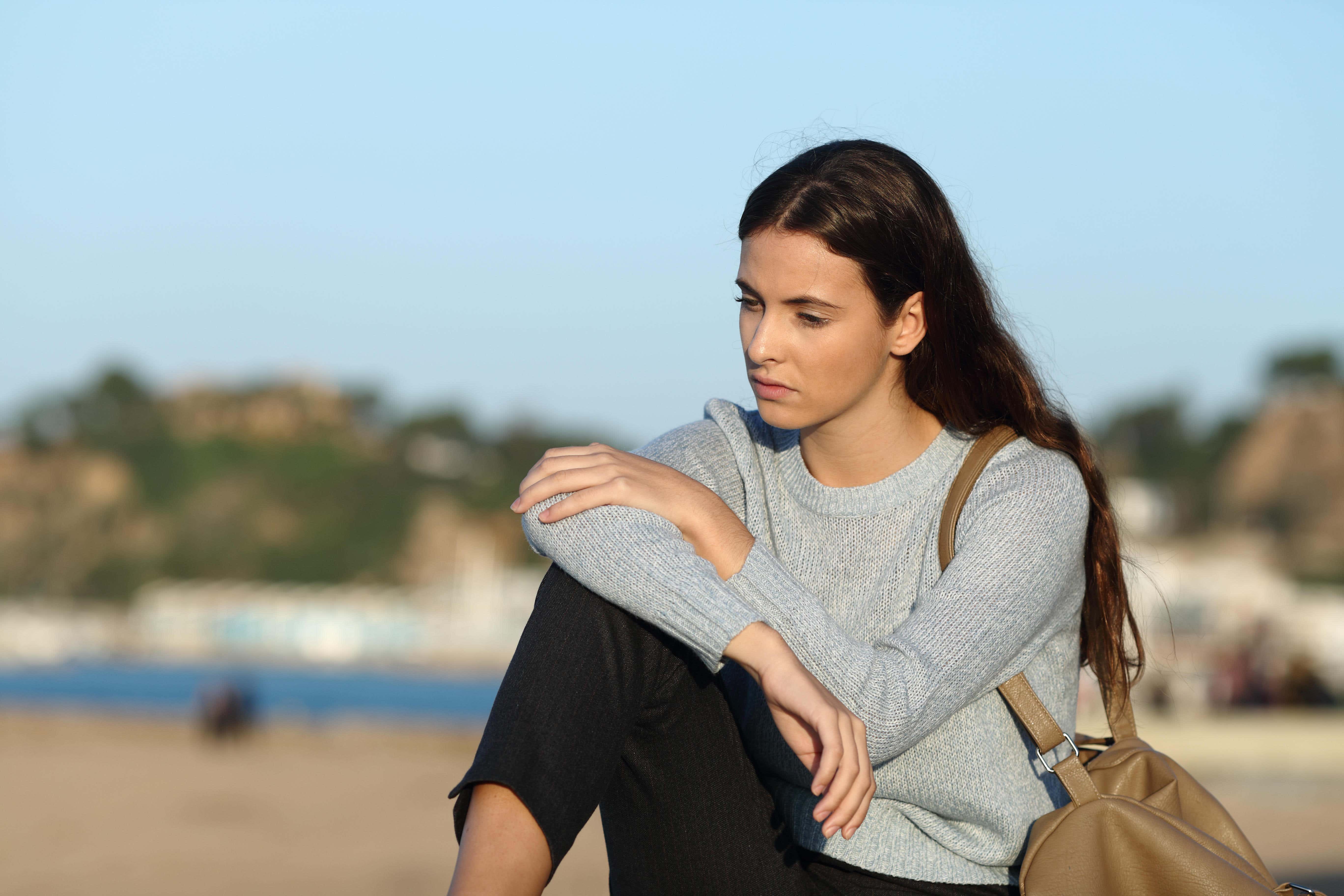 People who experience summer blues symptoms often feel isolated (Alamy/PA)