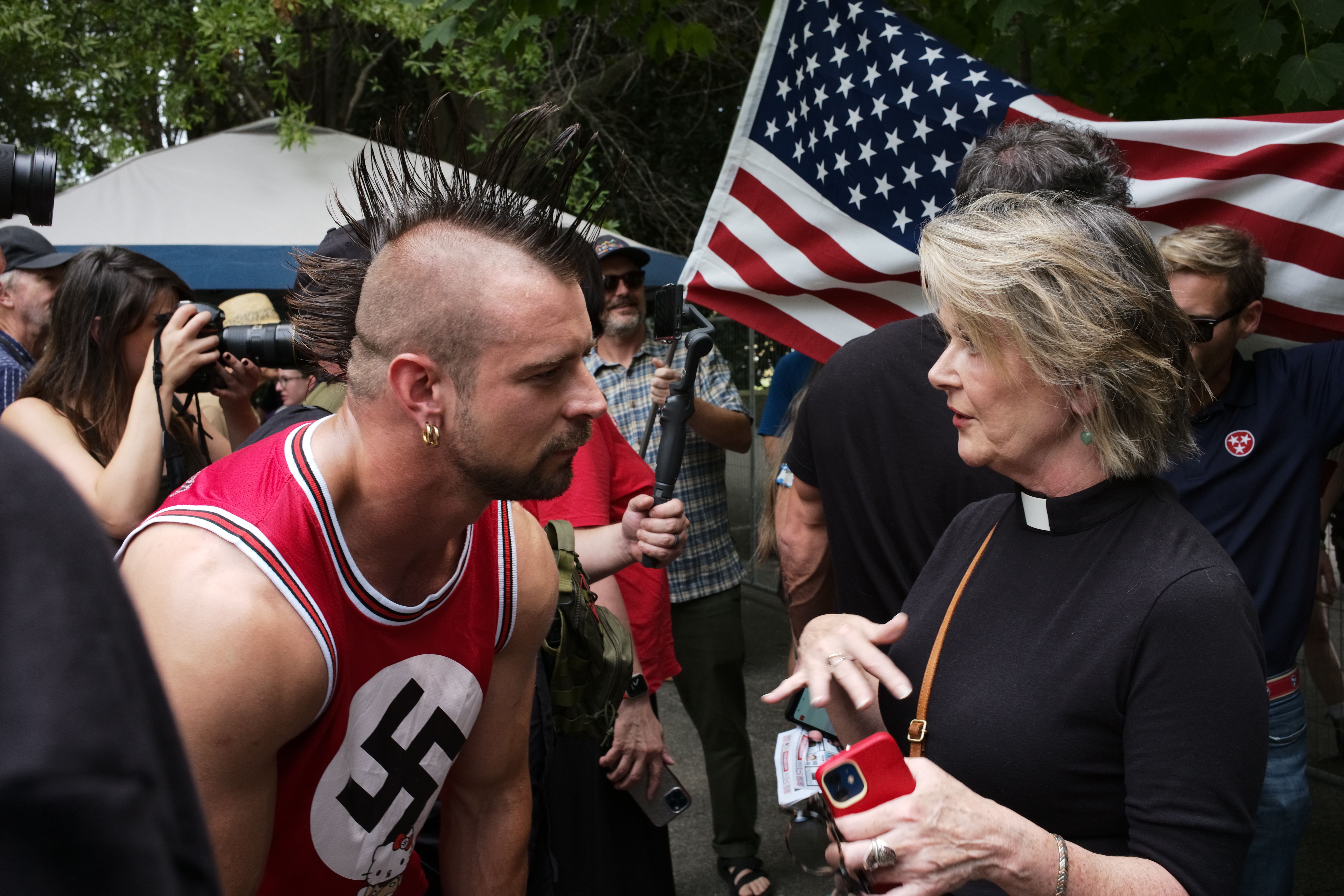 Neelley Hicks, a Reverend in the United Methodist Church tries to find out why a member of Neo-Nazi group Goyim Defense League has his point of view outside of the ‘Nashville Together’ event at the Bicentennial Park