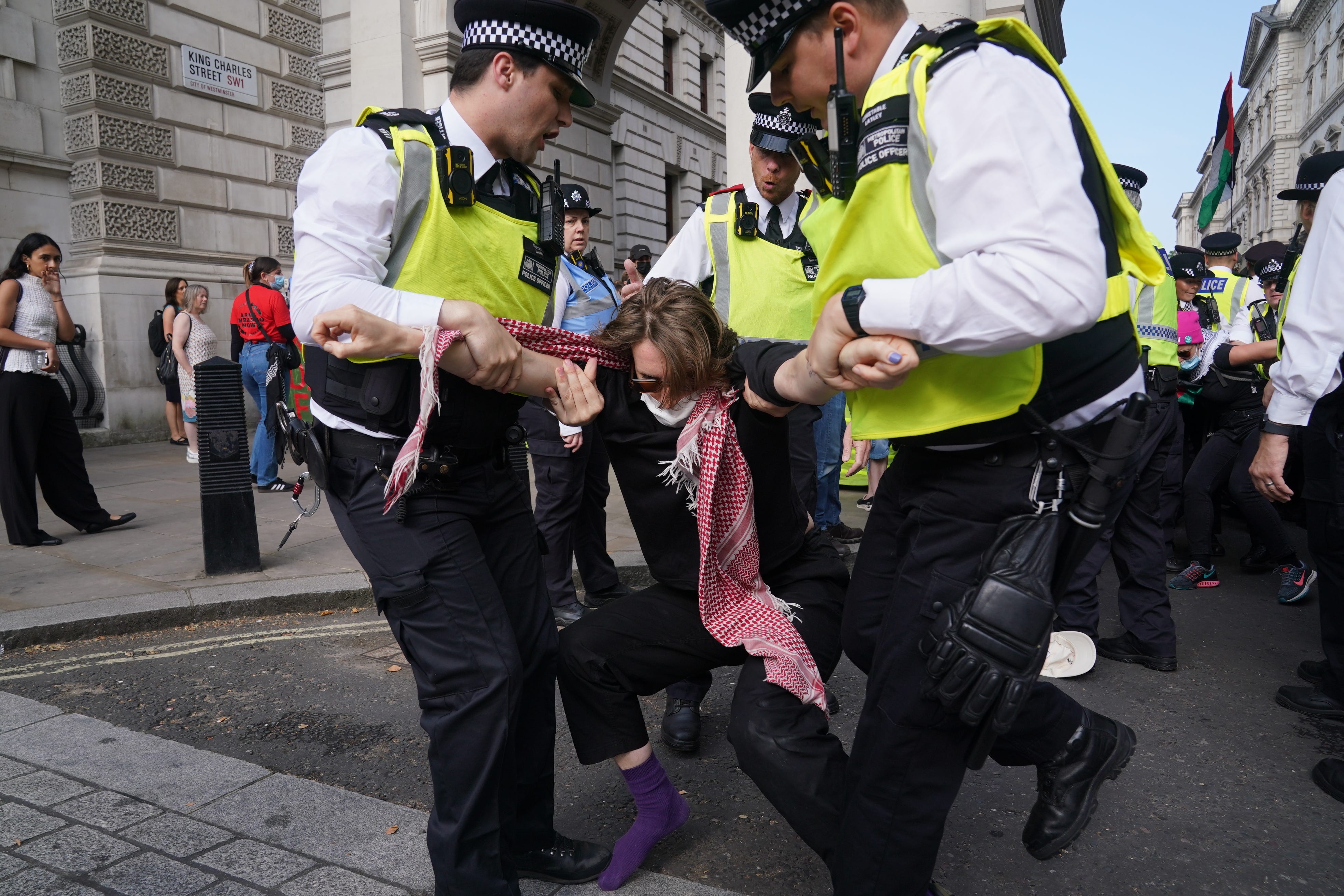 Police officers remove a protester (Lucy North/PA)