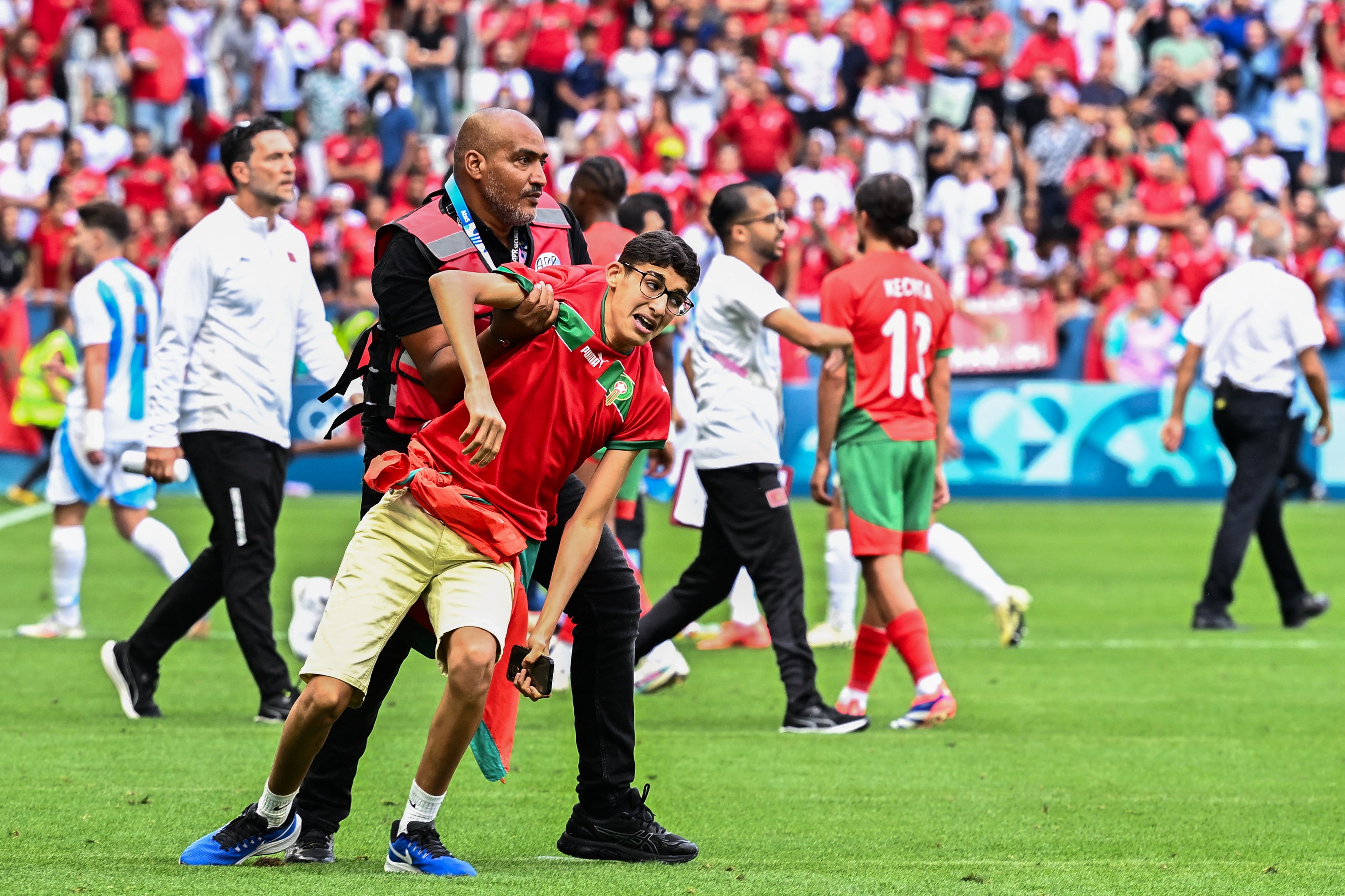 Fans stormed the pitch in Saint-Etienne