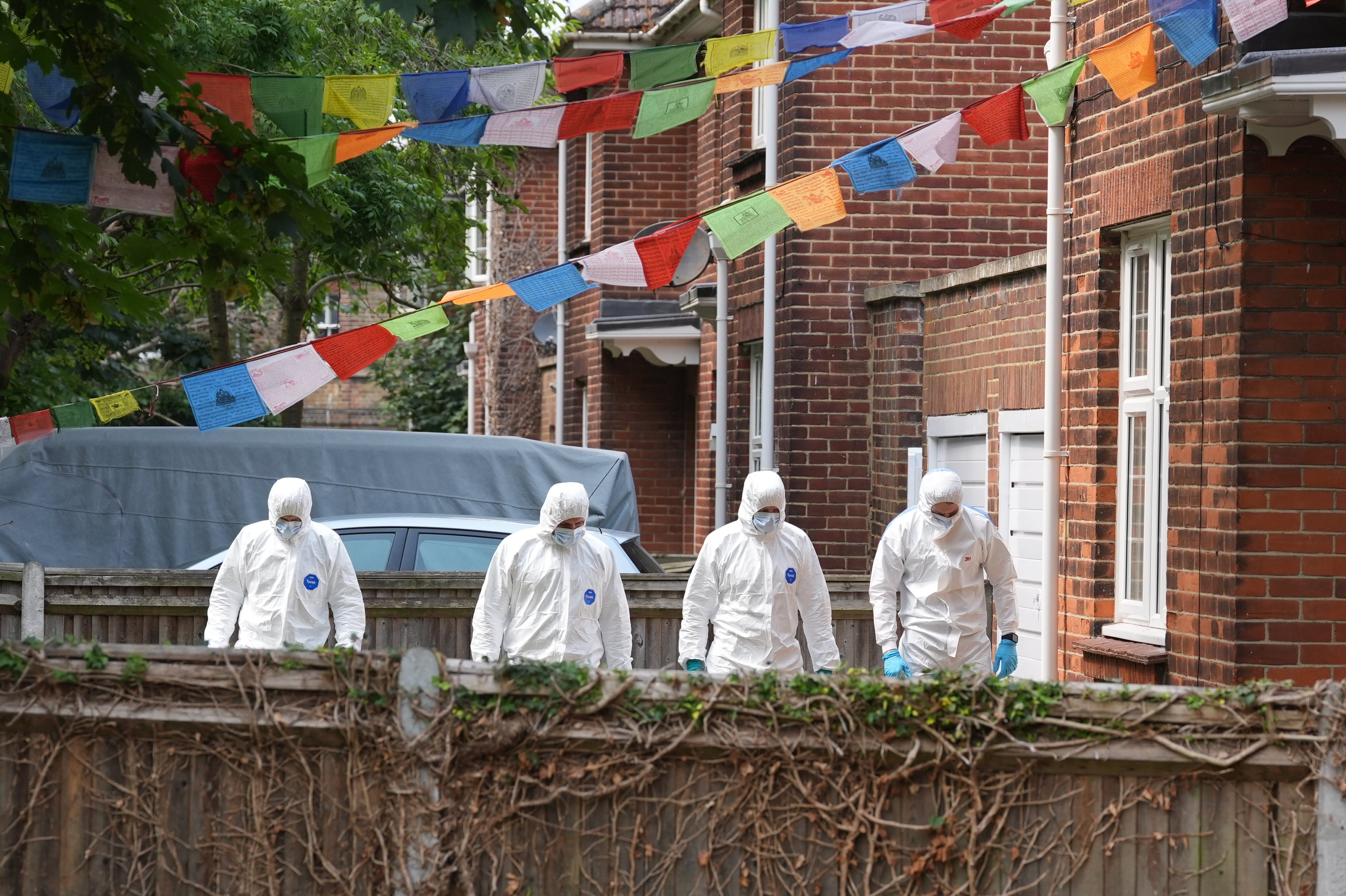 Forensic officers carrying out a search after a soldier was attacked