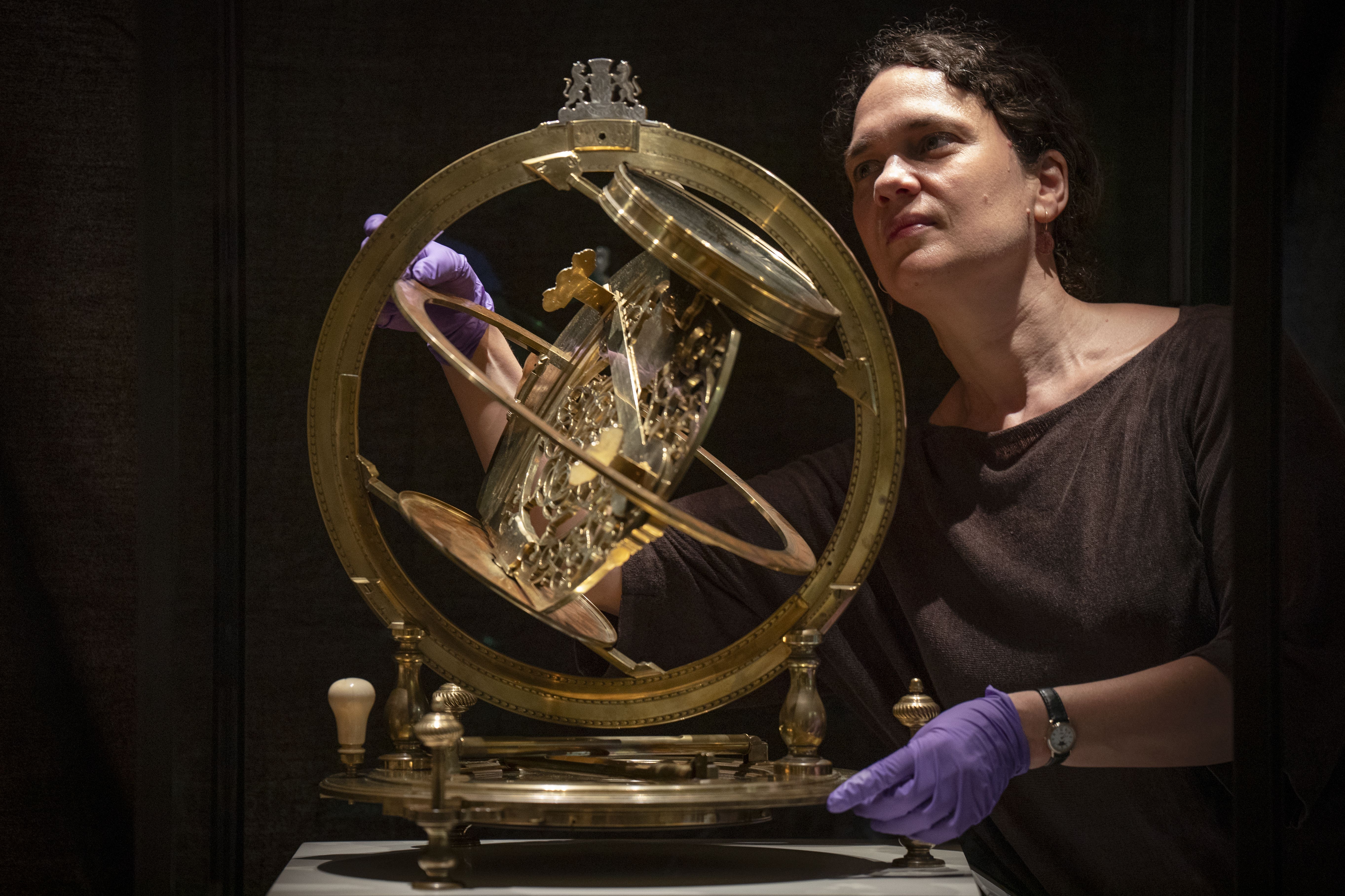 Principal curator of science Dr Rebekah Higgitt alongside the Ilay Glynne sundial (Jane Barlow/PA)