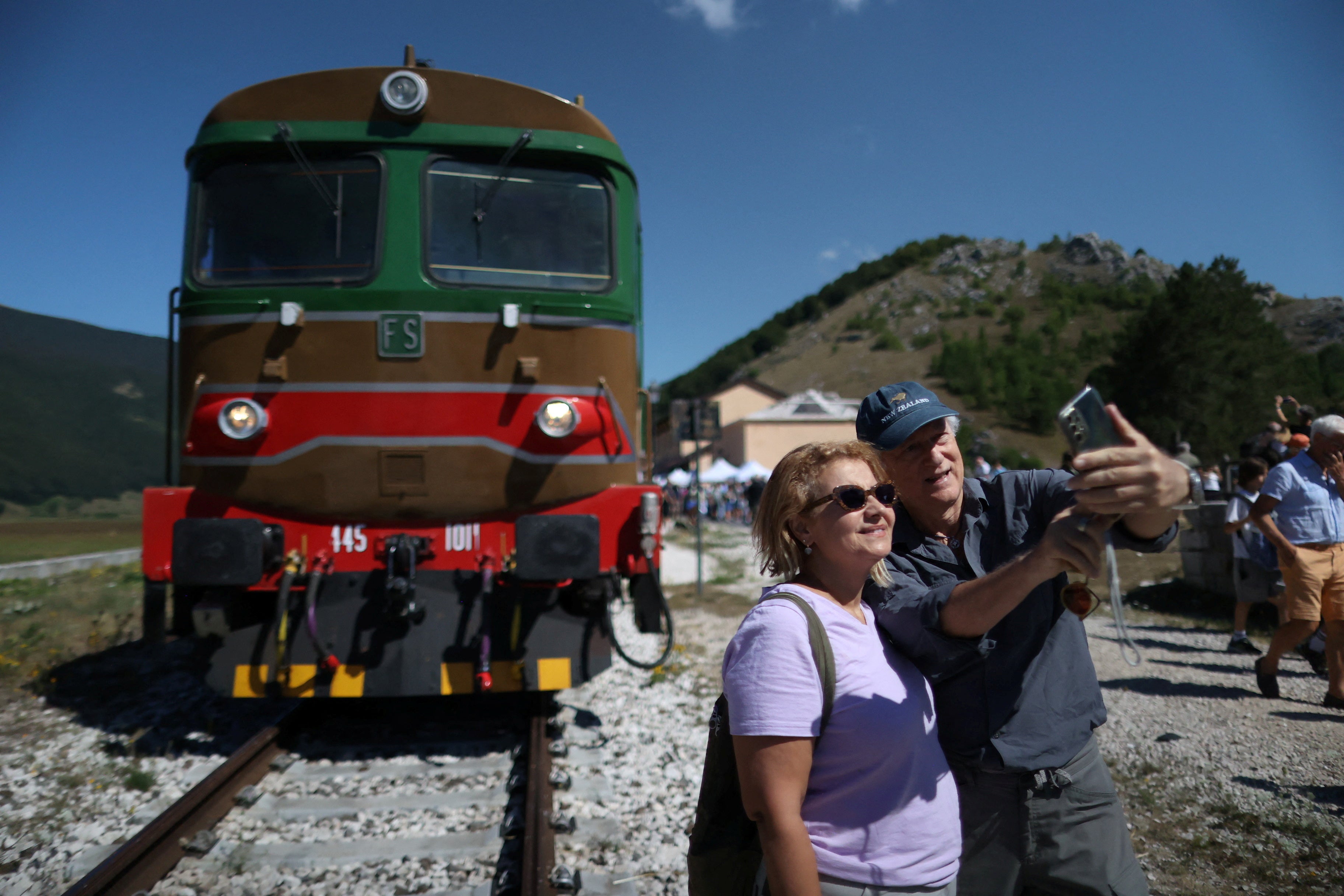 All aboard: Passengers pose for a selfie picture in front of a vintage train in Palena, Italy