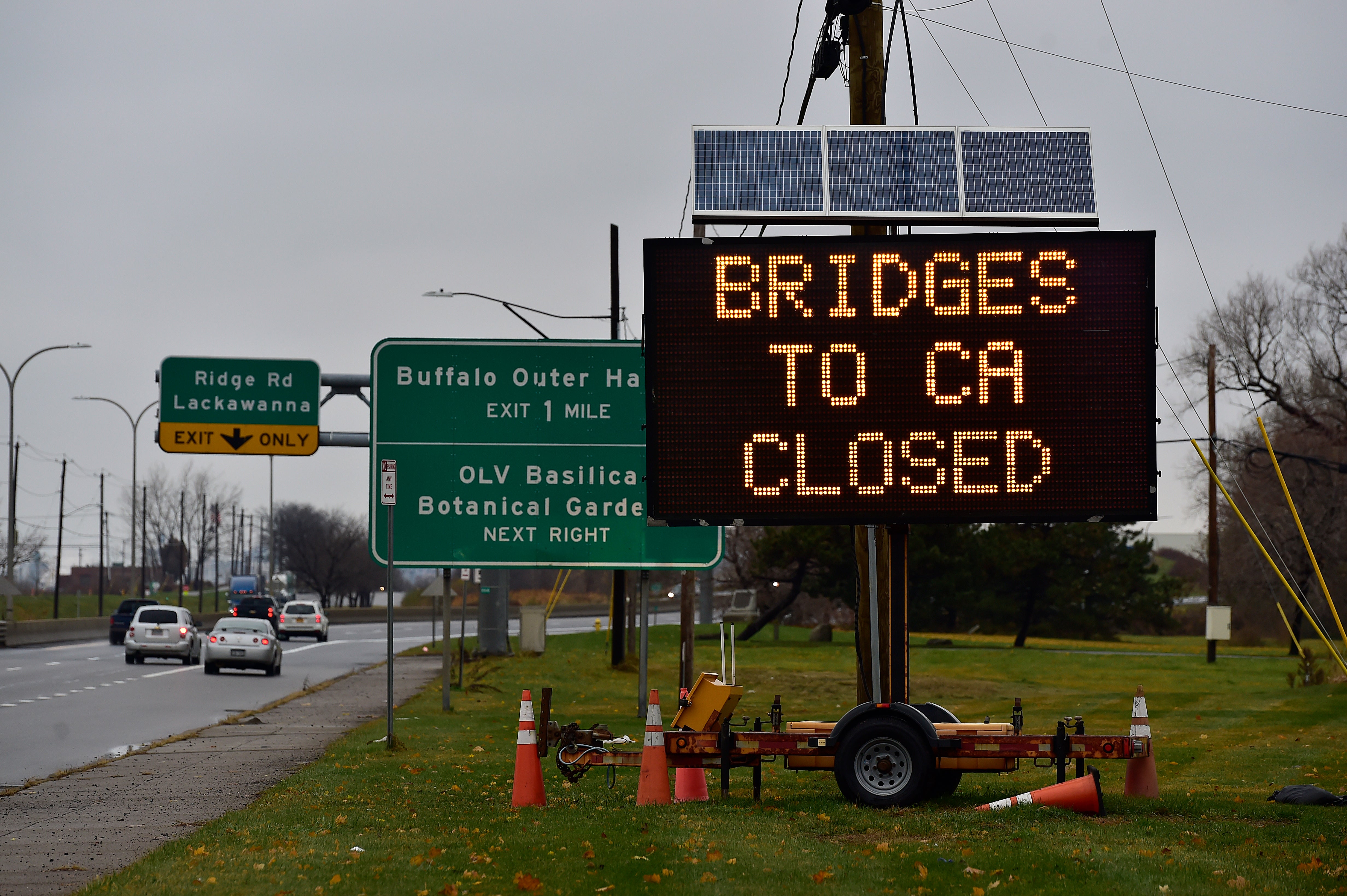 A sign that reads, ‘Bridges to CA closed’ following a deadly car crash and explosion on Niagara Falls’ Rainbow Bridge in November 2023. After an eight-month investigation, officials still do not know what caused the crash