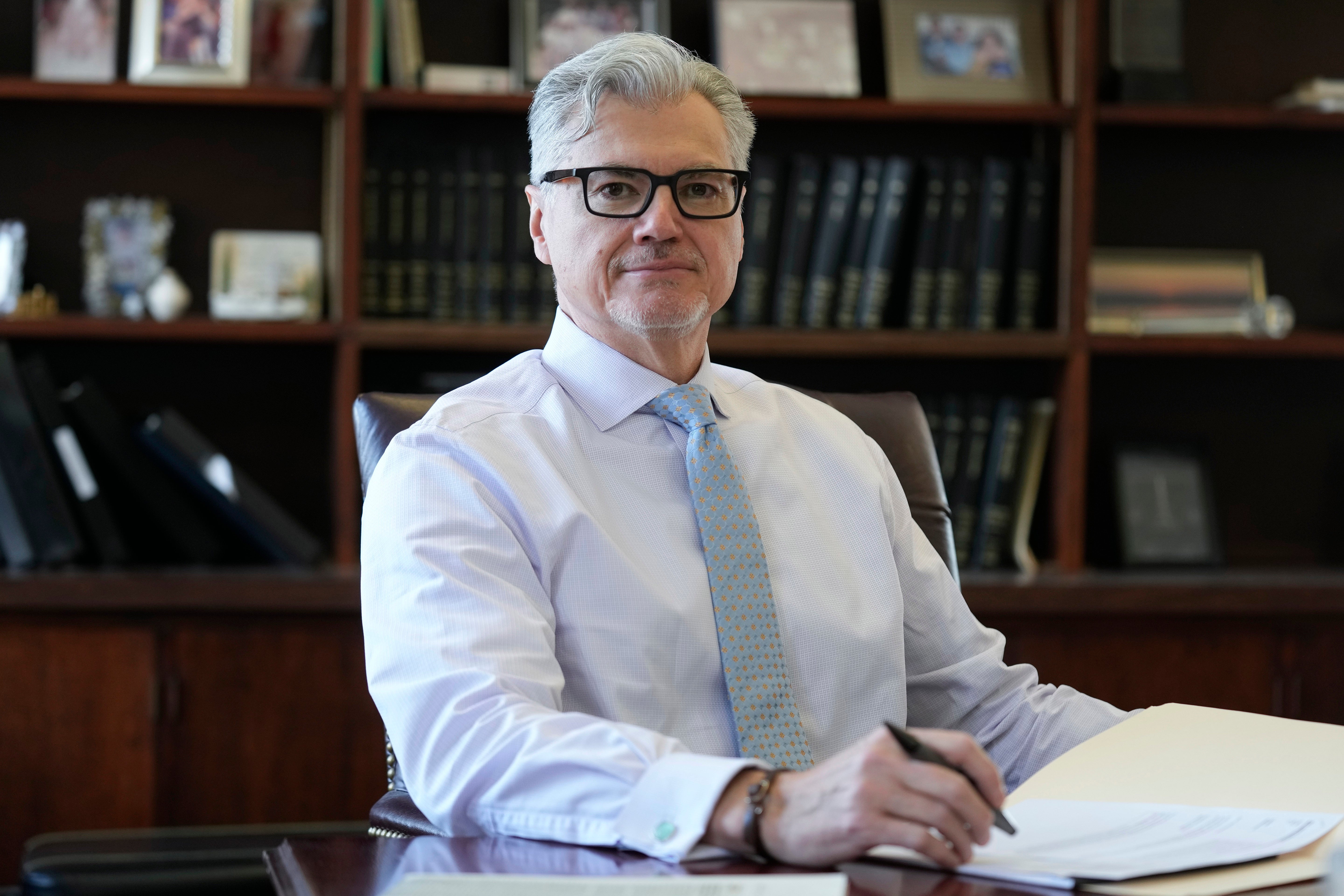 New York Justice Juan Merchan, pictured in his office in March, is set to decide in September whether to reverse Donald Trump’s conviction in his hush money case.