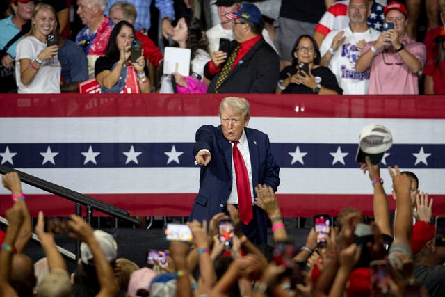 <p>Former US President and 2024 Republican presidential candidate Donald Trump points to supporters in the crowd after speaking during a campaign rally at the Bojangles Coliseum in Charlotte, North Carolina, on 24 July 2024</p>