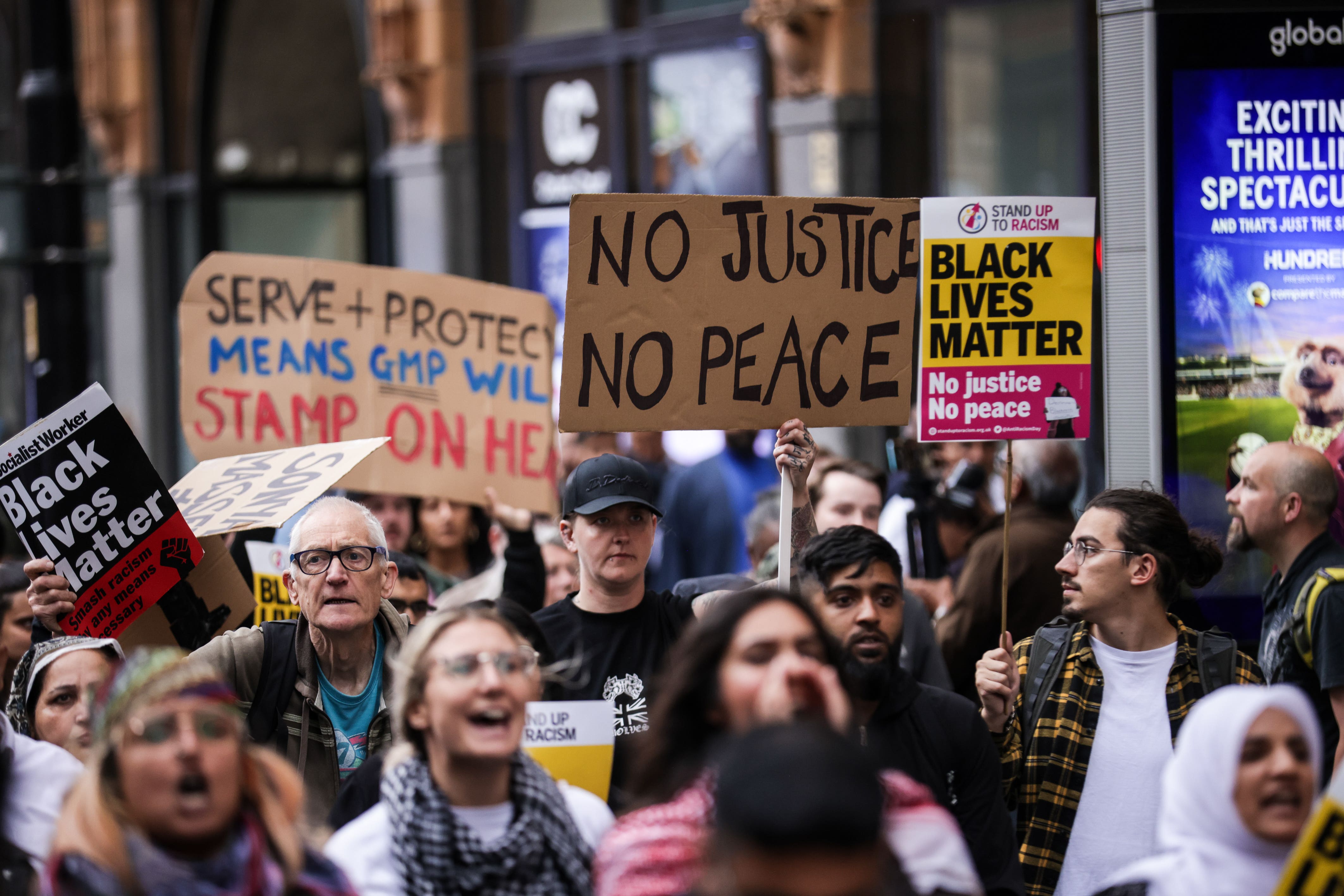 A Stand Up To Racism demonstration in Manchester after a police officer was suspended after a video which appeared to show a man being kicked as he lay on the floor (James Speakman/PA)