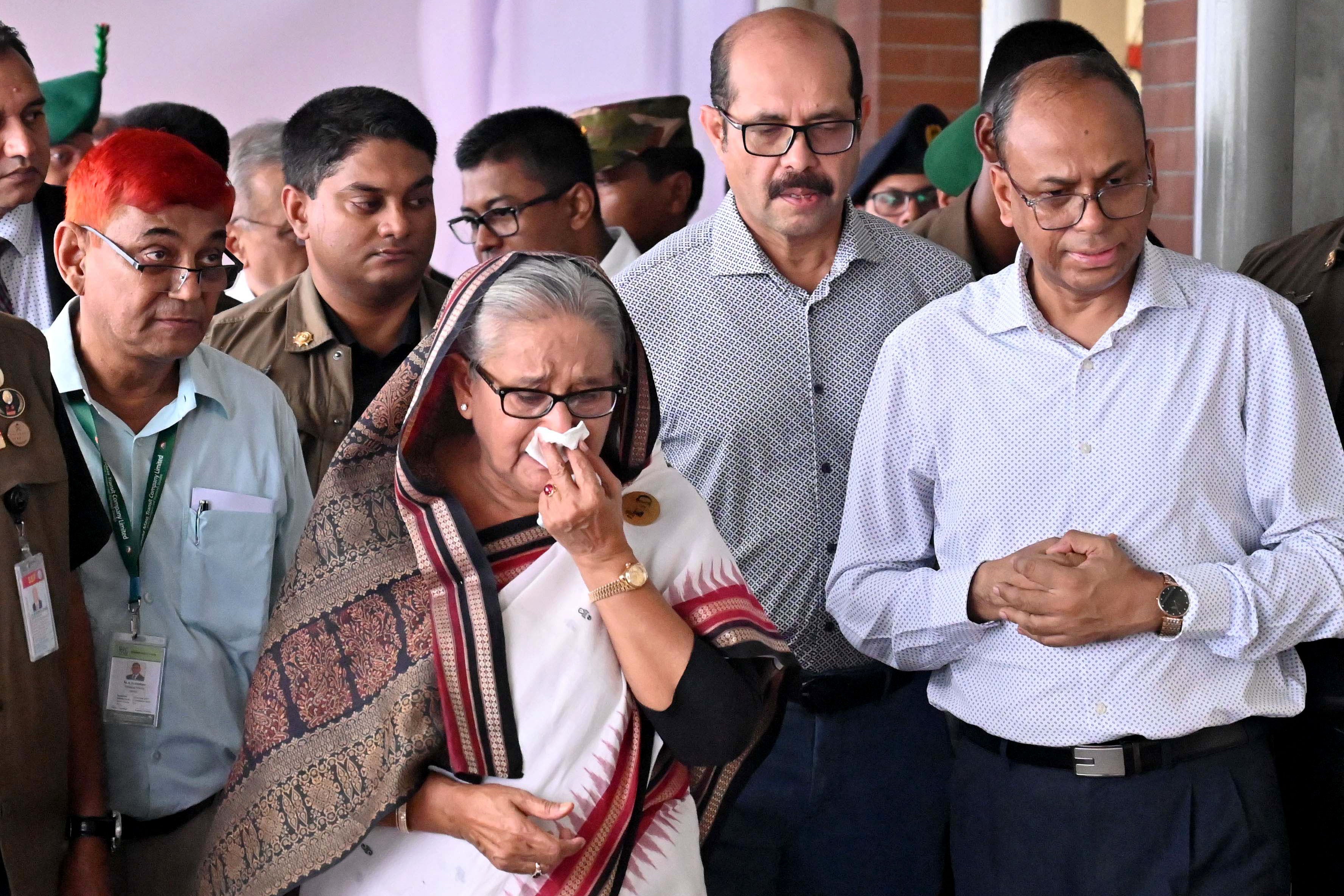 Prime minister Sheikh Hasina weeps during a visit to a metro station in Mirpur vandalised by students during the anti-quota protest