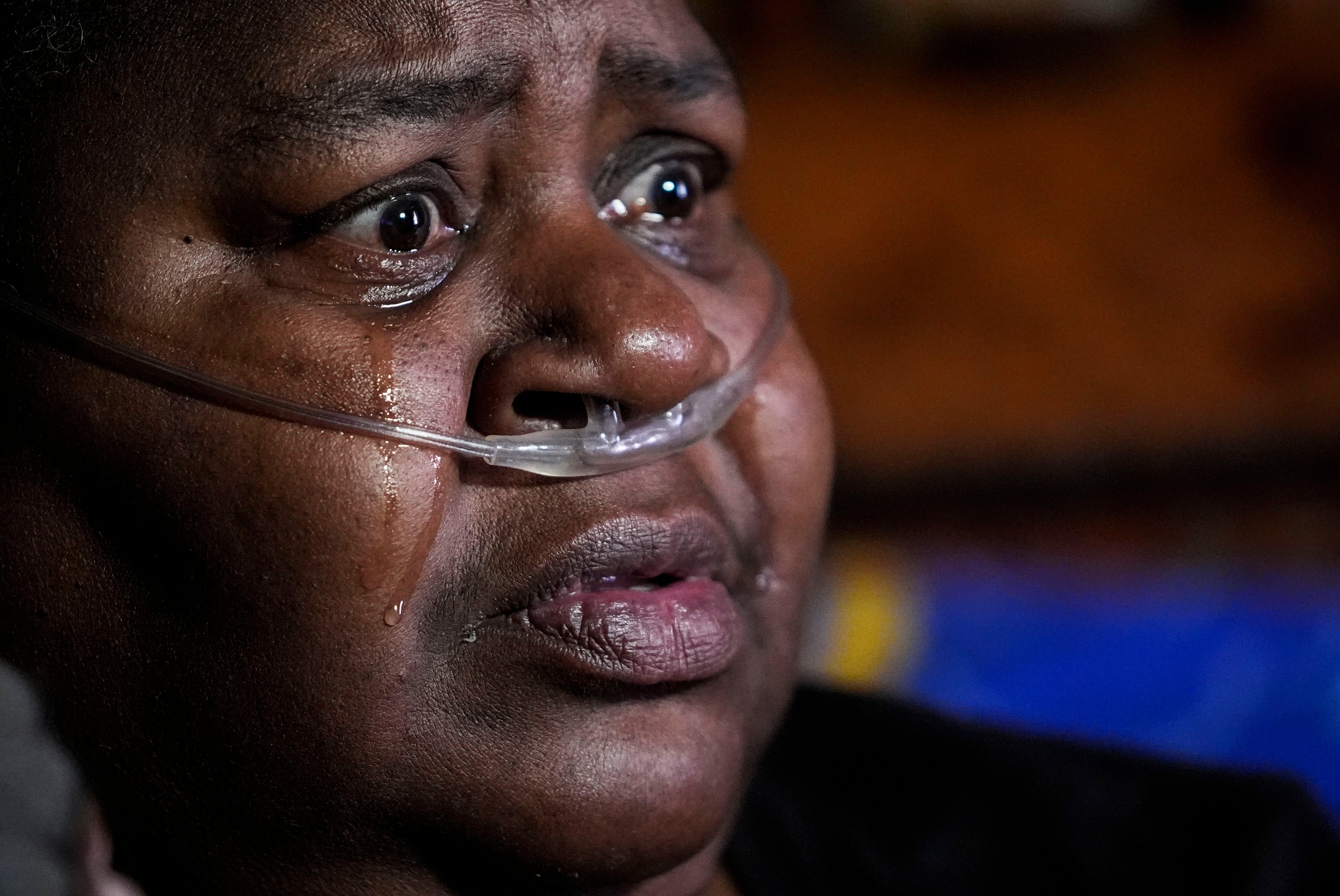 Biomass Boom Shelia Mae Dobbins cries as she talks about her health inside her home in Gloster