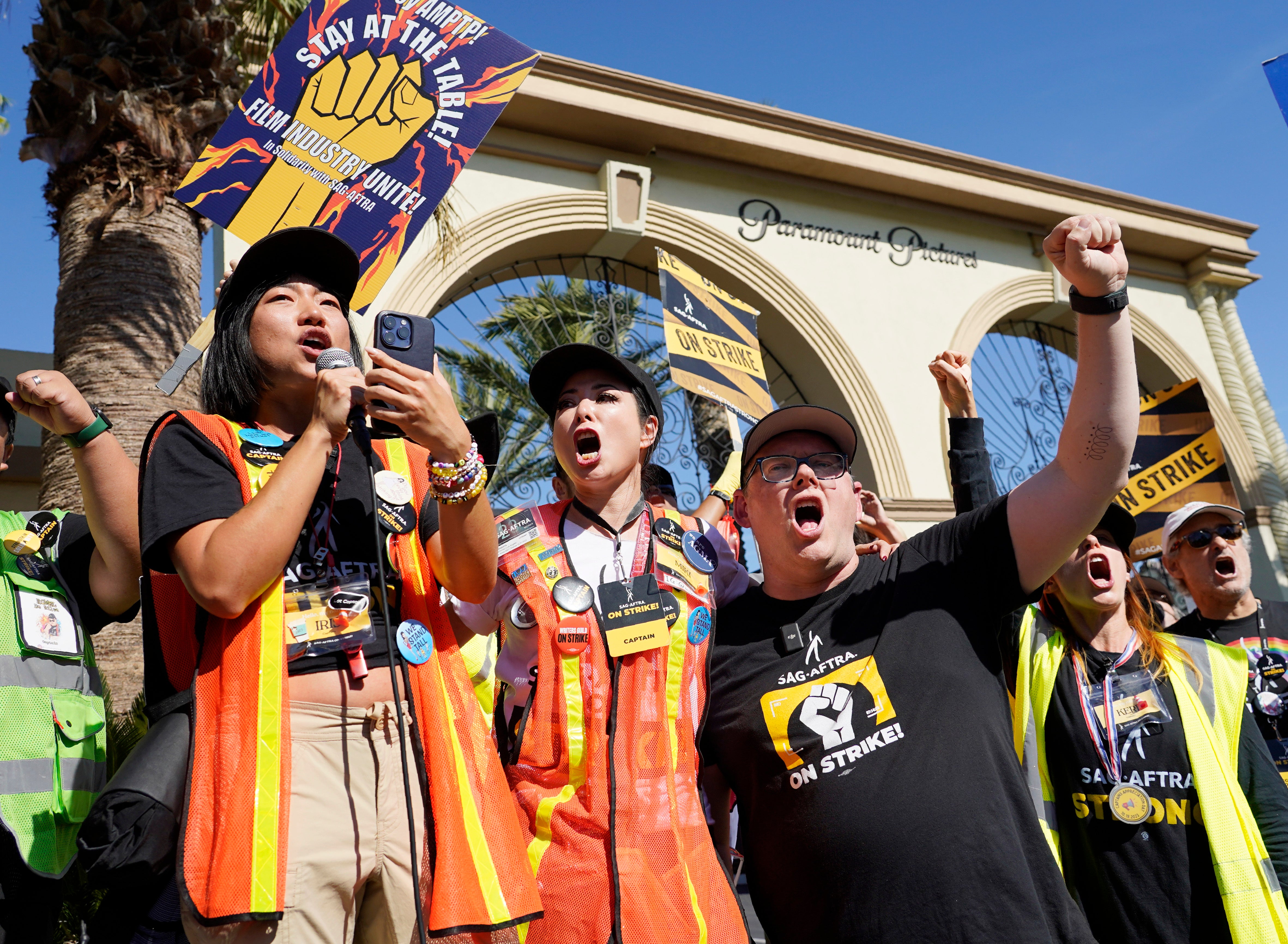 SAG-AFTRA captains Iris Liu and Miki Yamashita, center, and chief negotiator Duncan Crabtree-Ireland