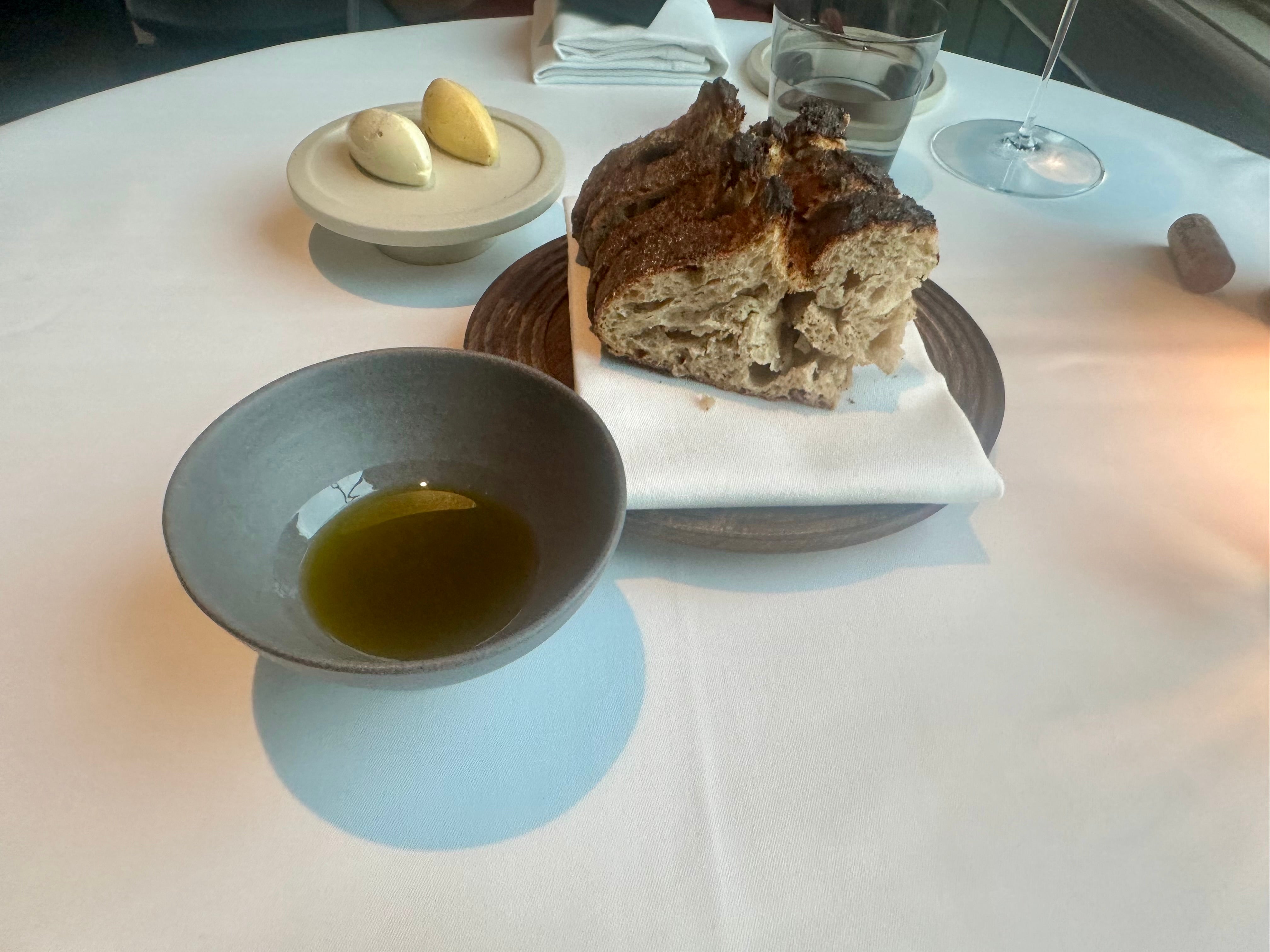 The bread was served with flavored butters and olive oils