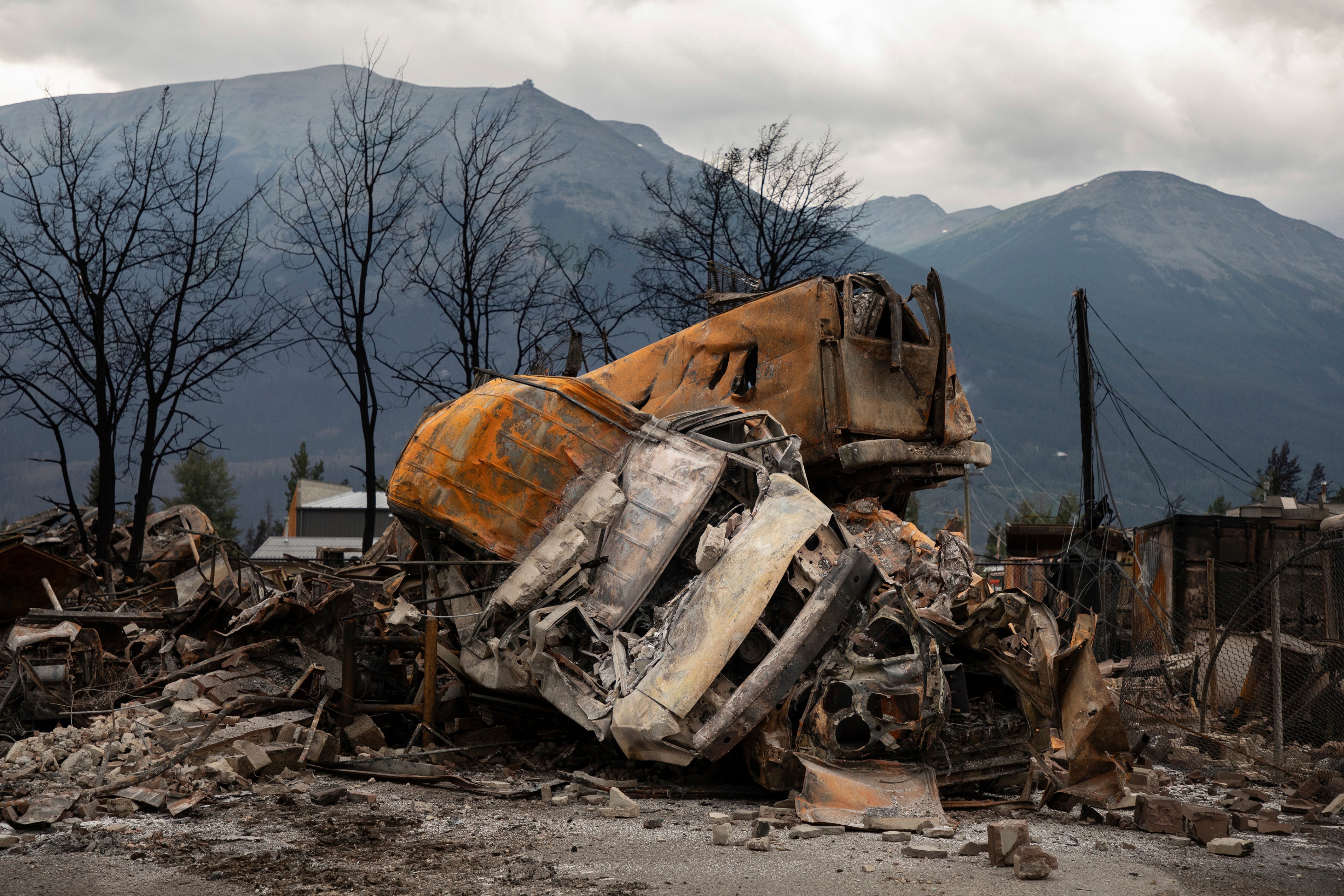 A small pile of burnt cars in Jasper, Alta., on Friday July 26, 2024. Wildfires encroaching into the townsite of Jasper forced an evacuation of the national park