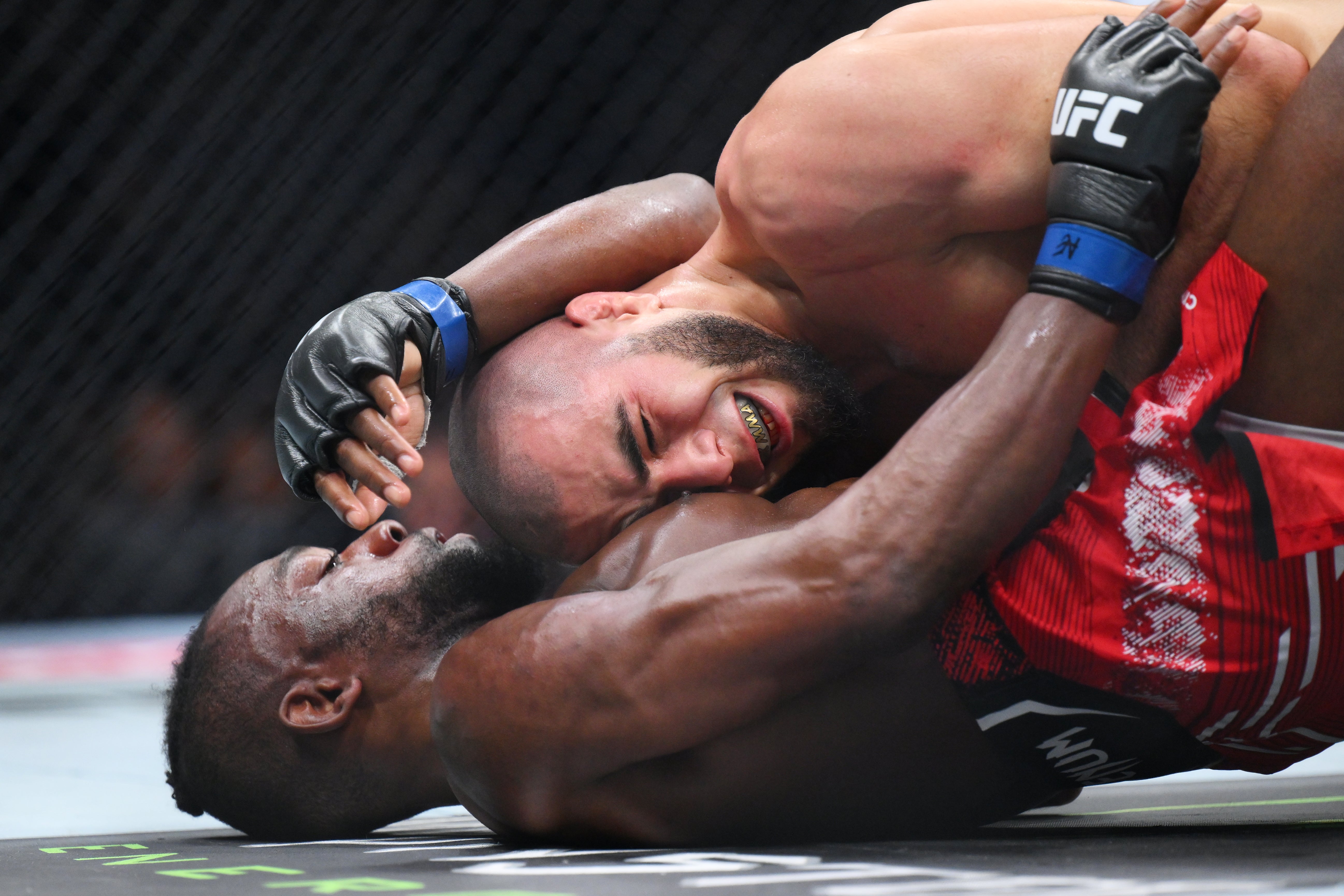 Muhammad Mokaev (top) ground out a win over Manel Kape