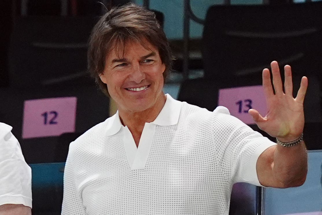 Tom Cruise waves to the crowd at the gymnastics (Mike Egerton, PA)