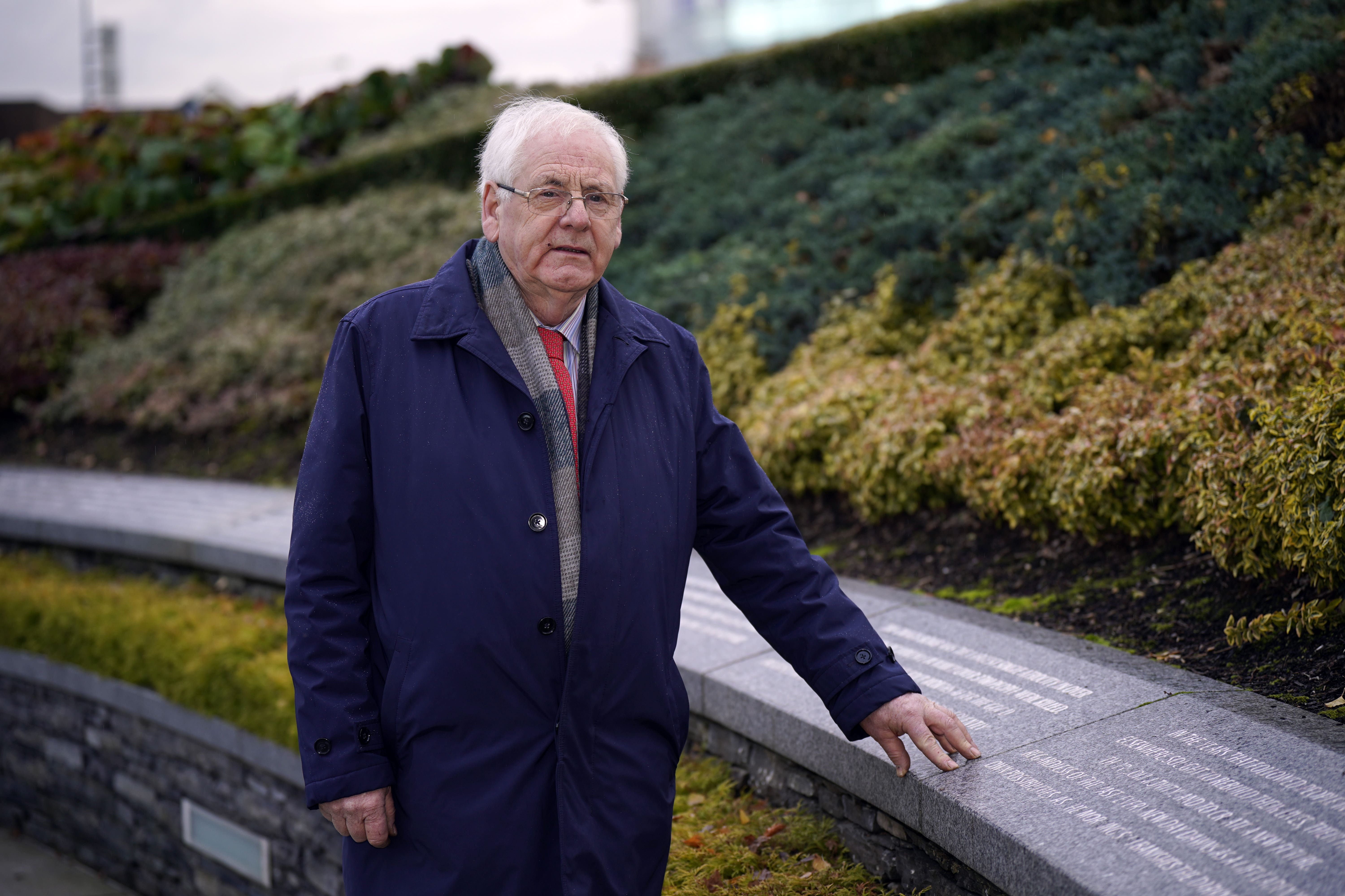 Michael Gallagher standing at the Memorial Garden in Omagh (PA)