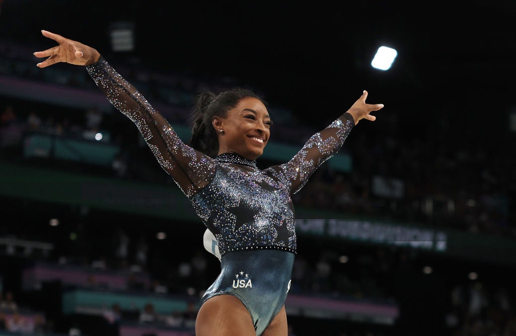 Simone Biles reacts after competing on the vault