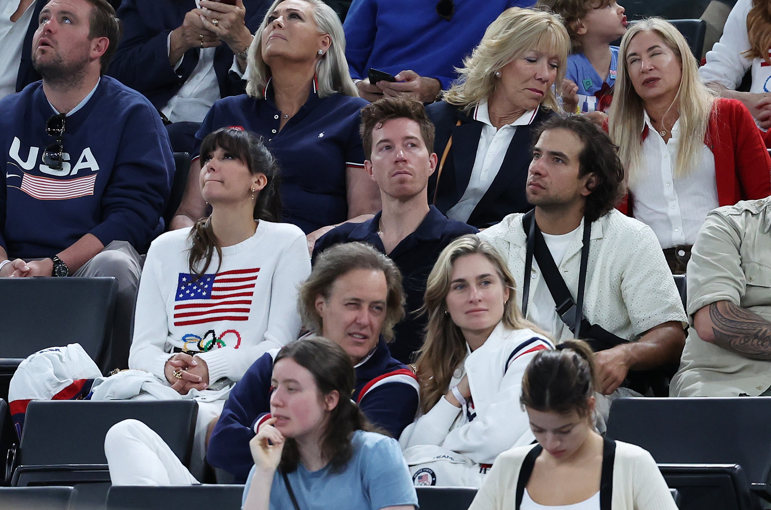 Nina Dobrev (L) and Shaun White (C) attend the Artistic Gymnastics Women’s Qualification