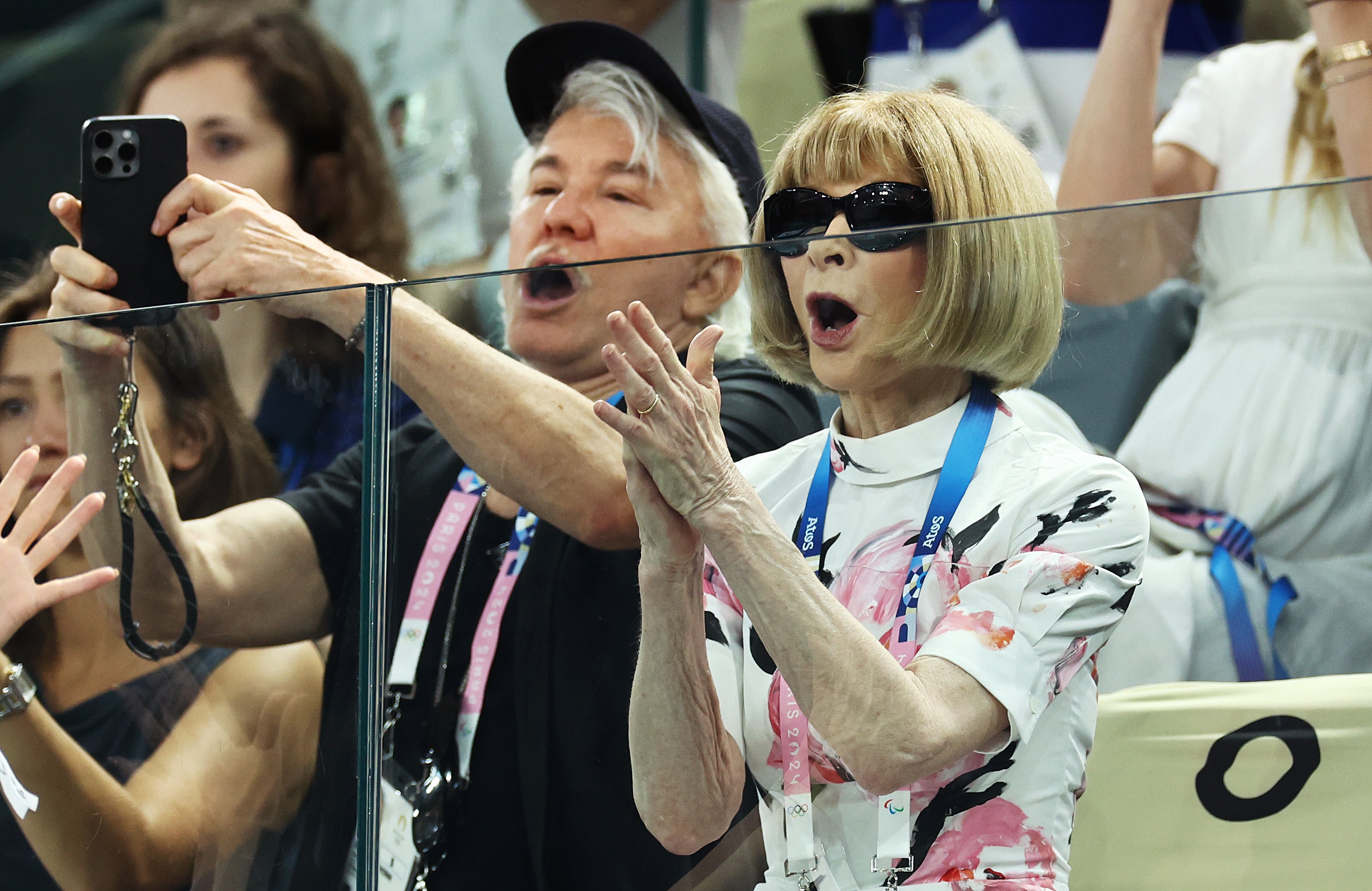 Anna Wintour and Baz Luhrmann cheer together