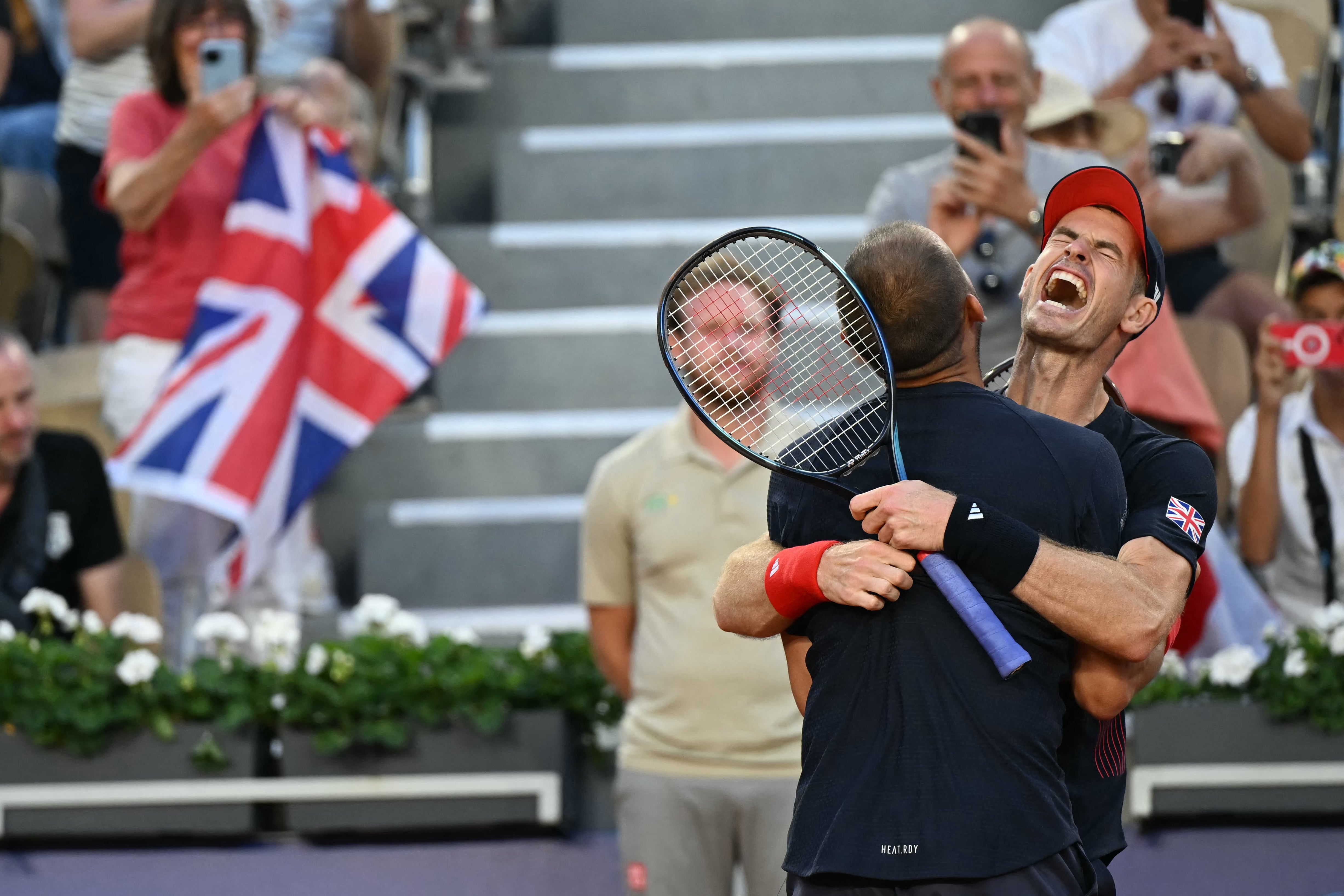 Murray and Evans celebrate winning match point after a saving five in the tiebreak