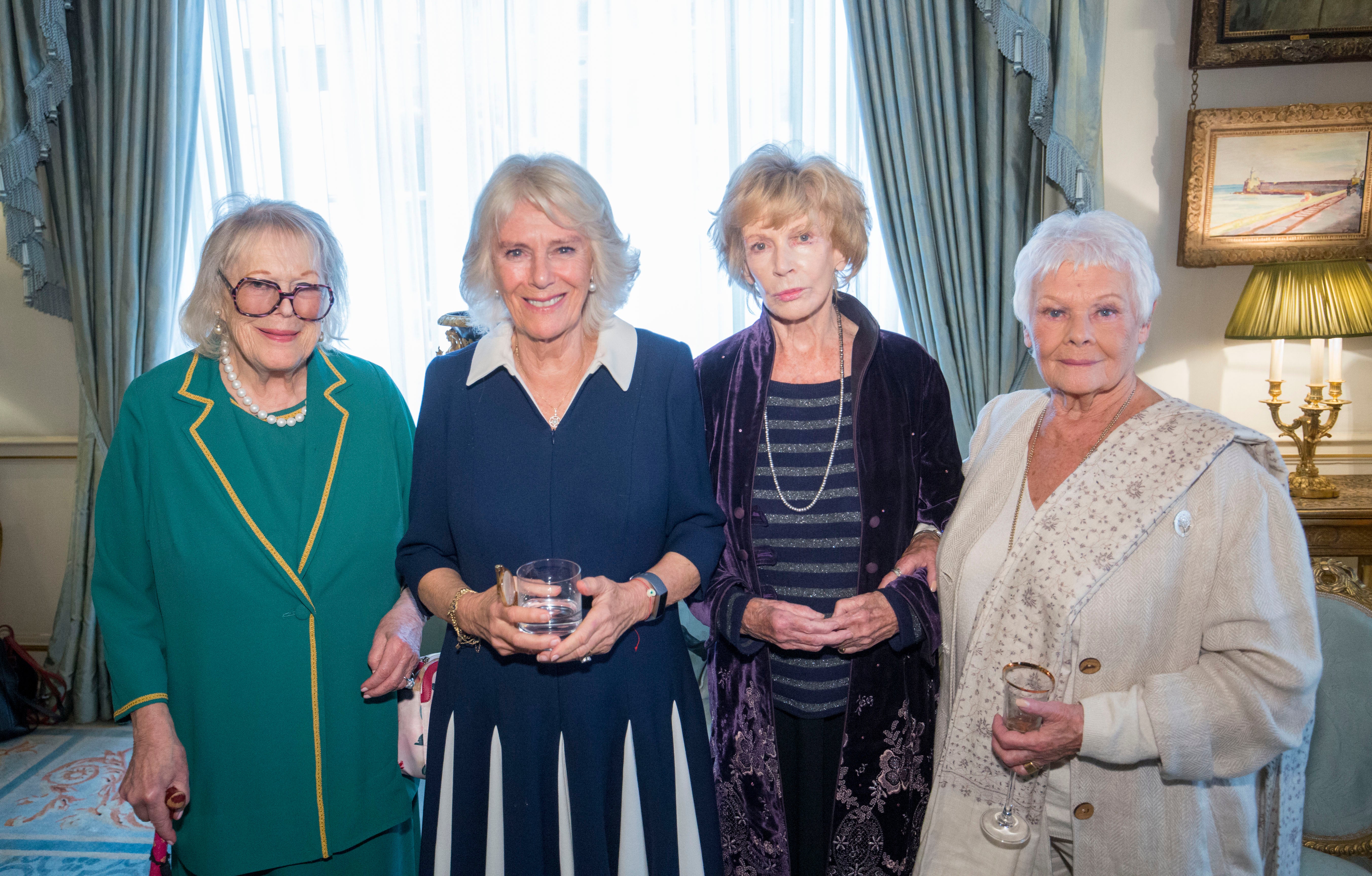 Camilla, Duchess of Cornwall (2nd L) with Dame Antonia Fraser (L), Dame Edna O’Brien (2nd R) and Dame Judy Dench, at a reception hosted by The Duchess of Cornwall, on 26 October, 2021 in London