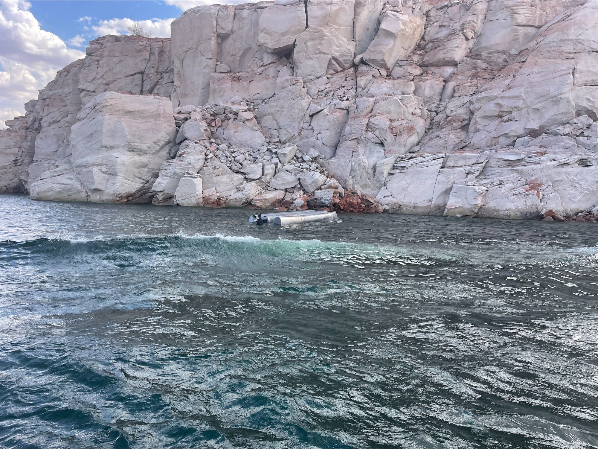 The Coconino County Sheriff’s Office released an image of the 25-foot pontoon that capsized in Lake Powell, Arizona, killing three, including two 4-year-old boys