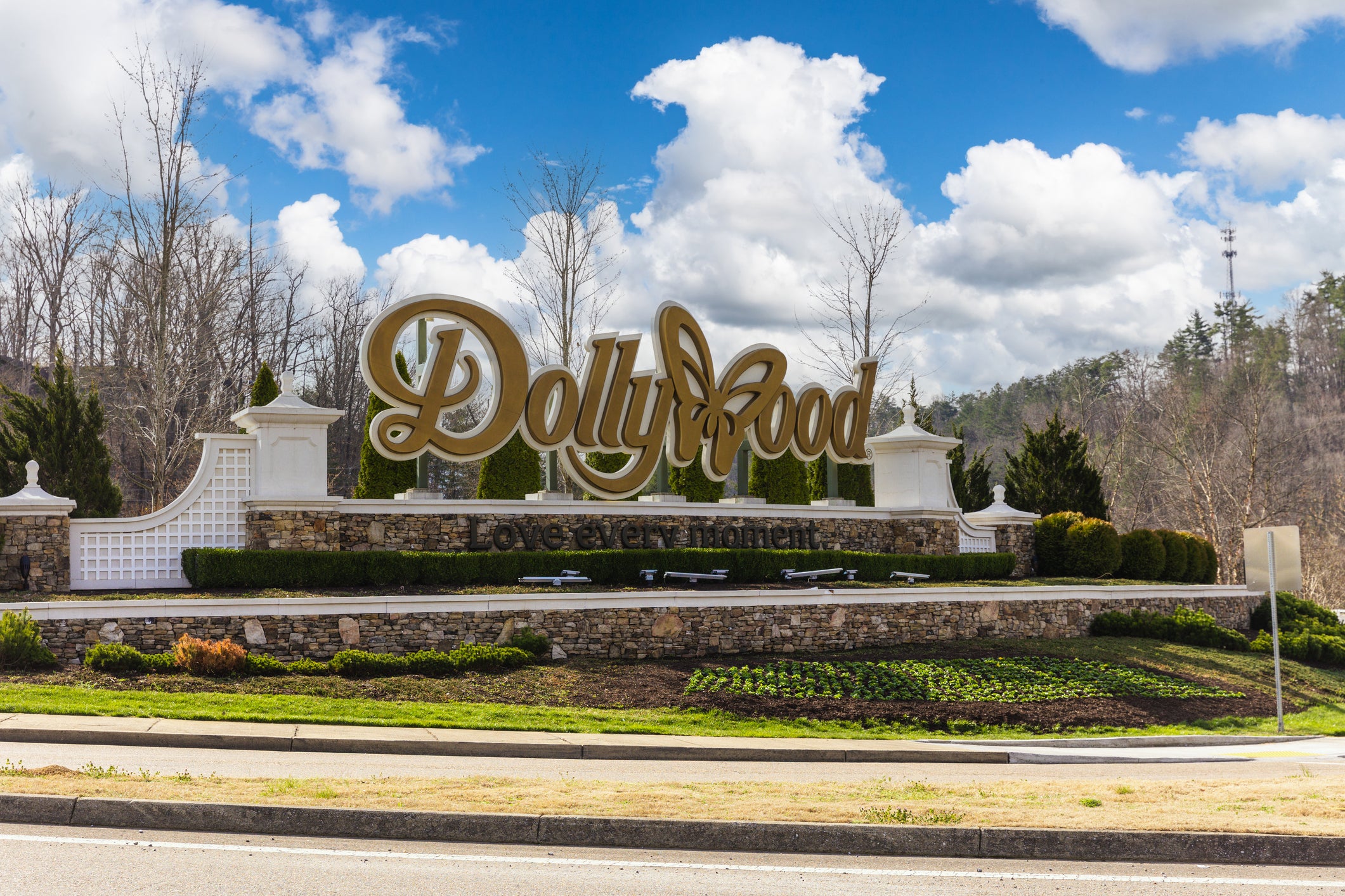 The ‘Dollywood’ sign pictured at the entrance to the theme park. Dolly Parton lent her name to the iconic tourist destination in 1986