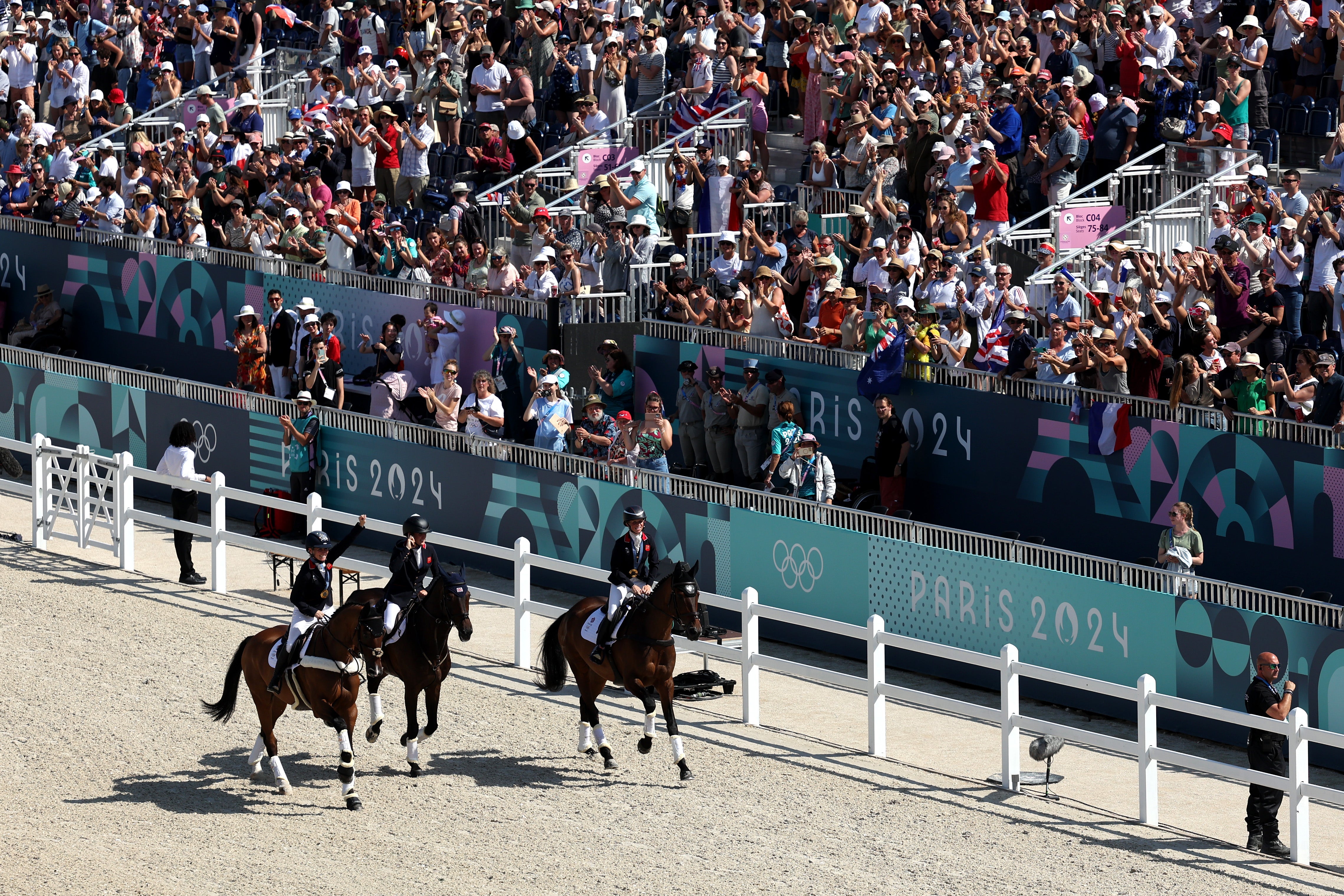 Gold medalists Rosalind Canter with horse Lordships Graffalo, Laura Collett with horse London 52 and Tom McEwen with horse JL Dublin of Team Great Britain