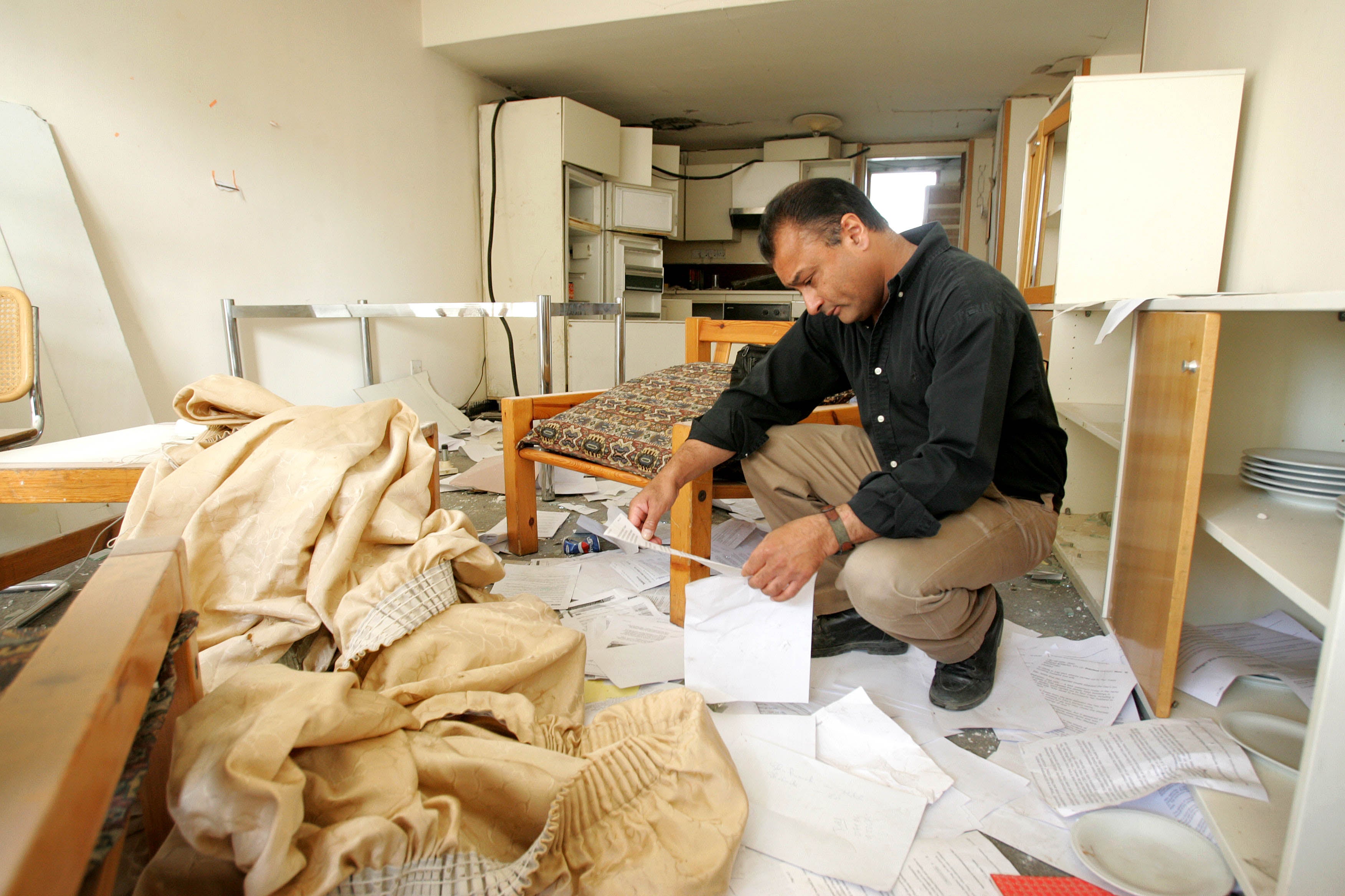 Kim Sengupta inspects his bombed out apartment in Baghdad, Iraq, in November 2005