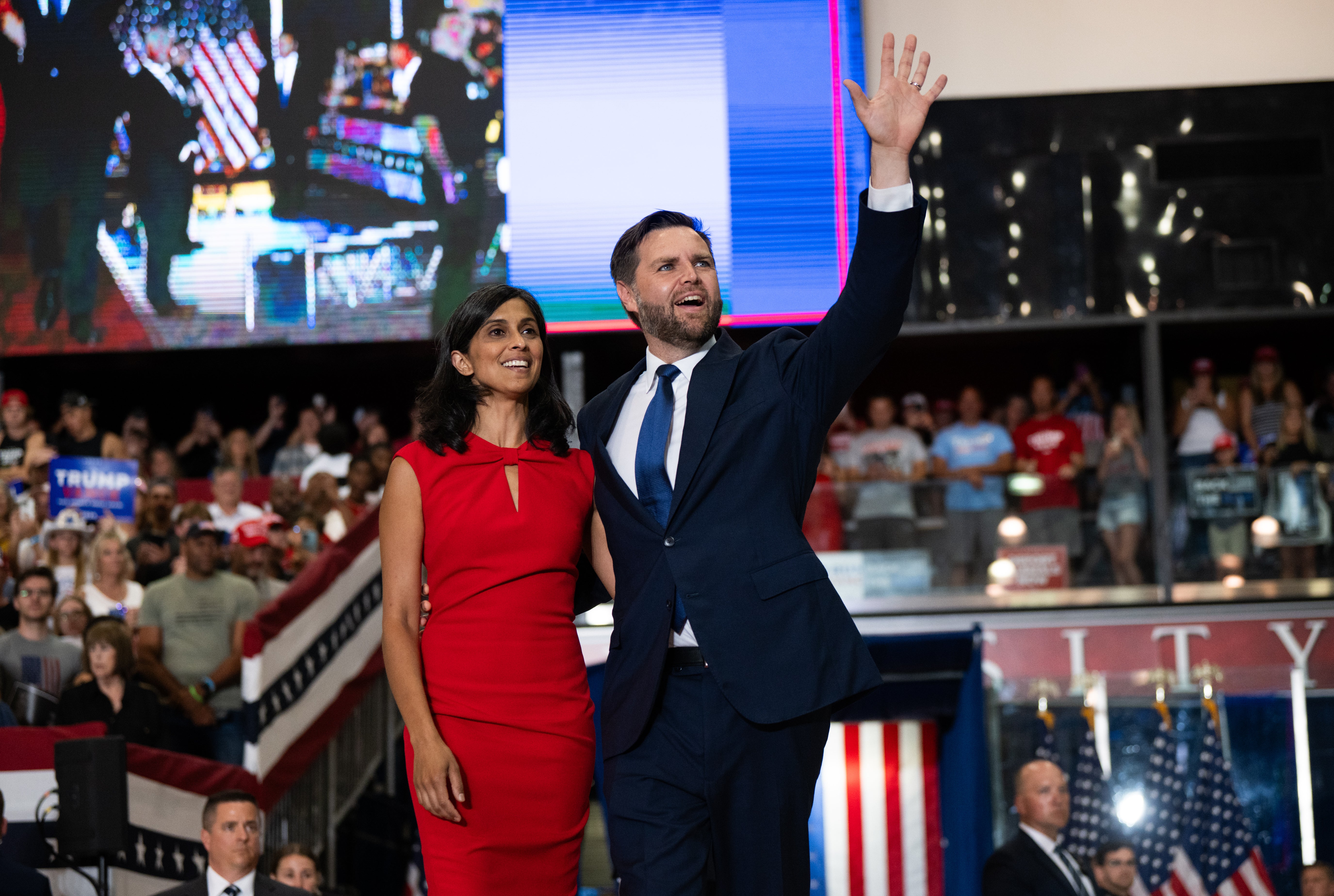 JD Vance and his wife Usha Vance take the stage to introduce Donald Trump during a rally in Minnesota on July 27