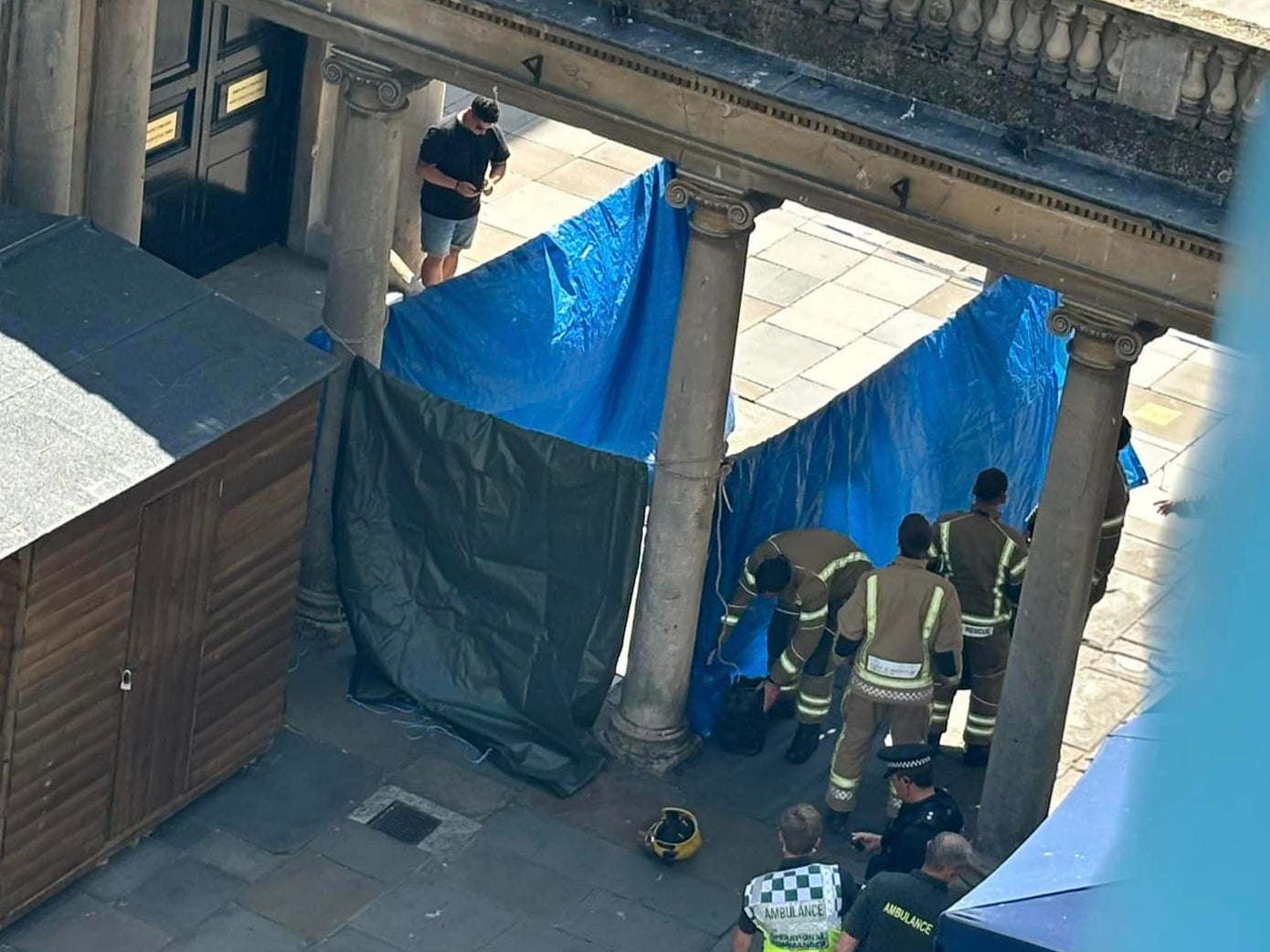 Handout photo courtesy of Chinua Thompson of the emergency services at the scene on Stall Street in Bath, after two people fell ill after being approached by a woman with a bag