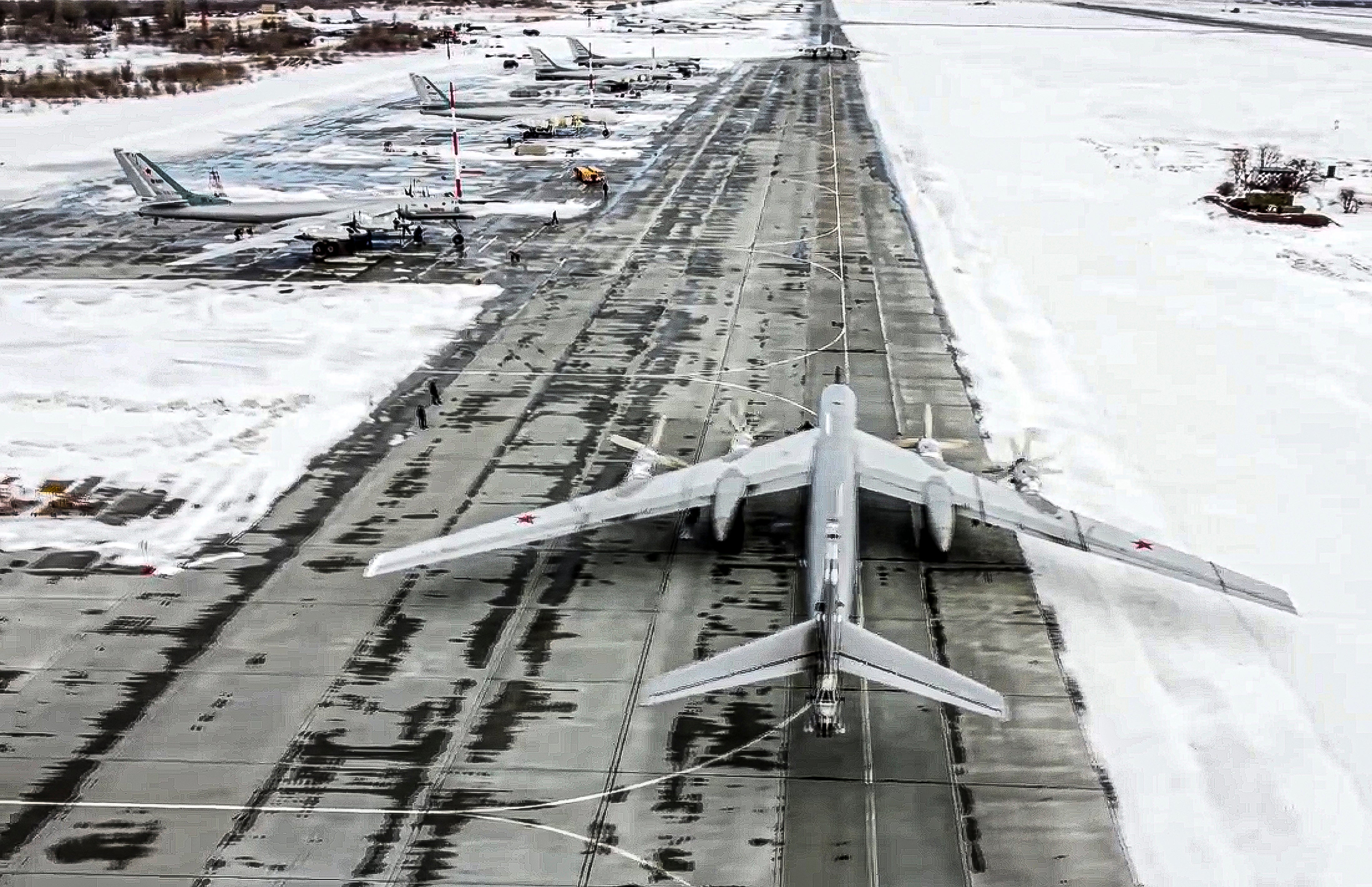 In this image from video provided by the Russian Defense Ministry Press Service, a Tu-95 strategic bomber from the Russian air force prepares to take off from an air base in Engels near the Volga River in Russia, on January 24, 2022