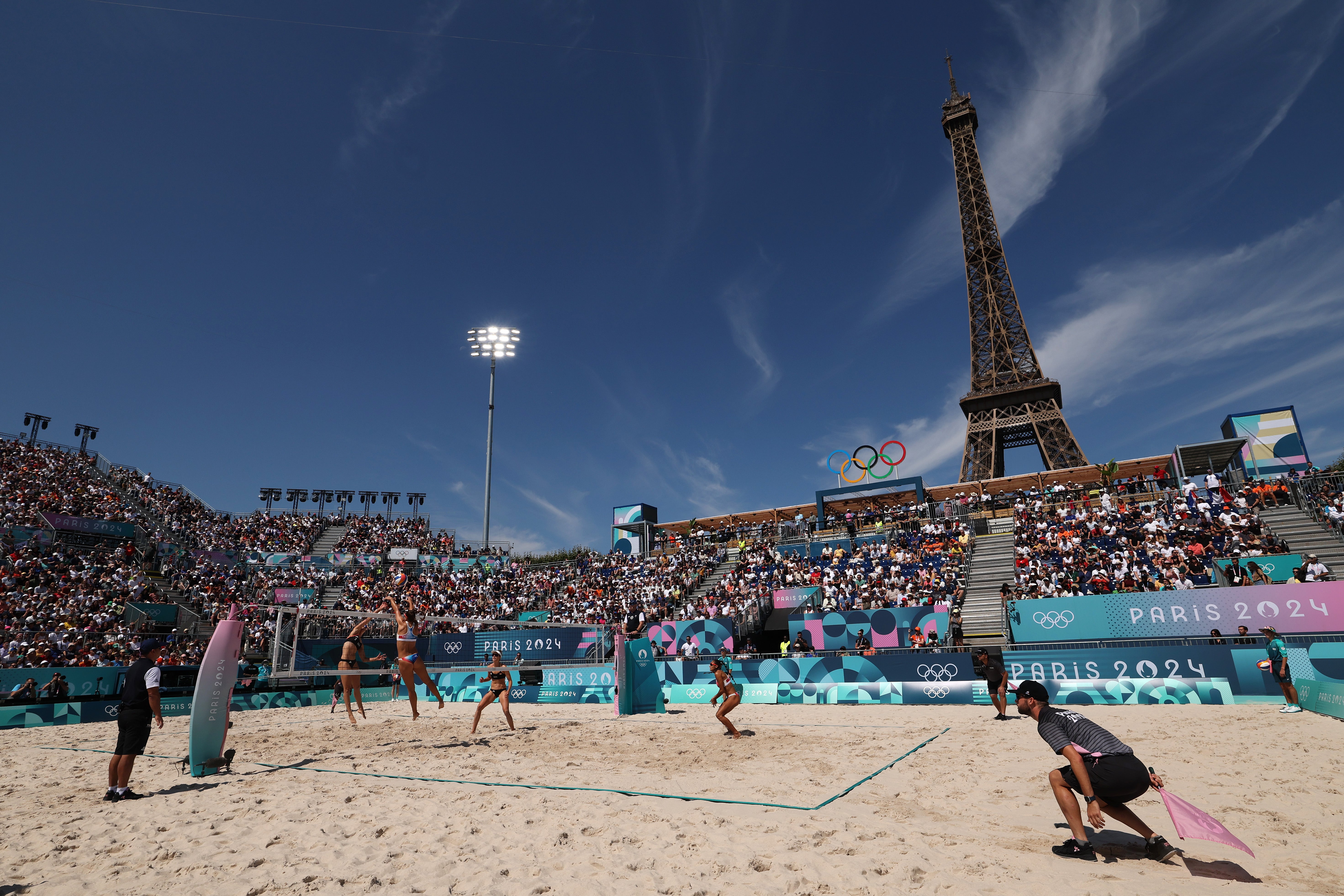 Action in the beach volleyball underneath the Eiffel Tower