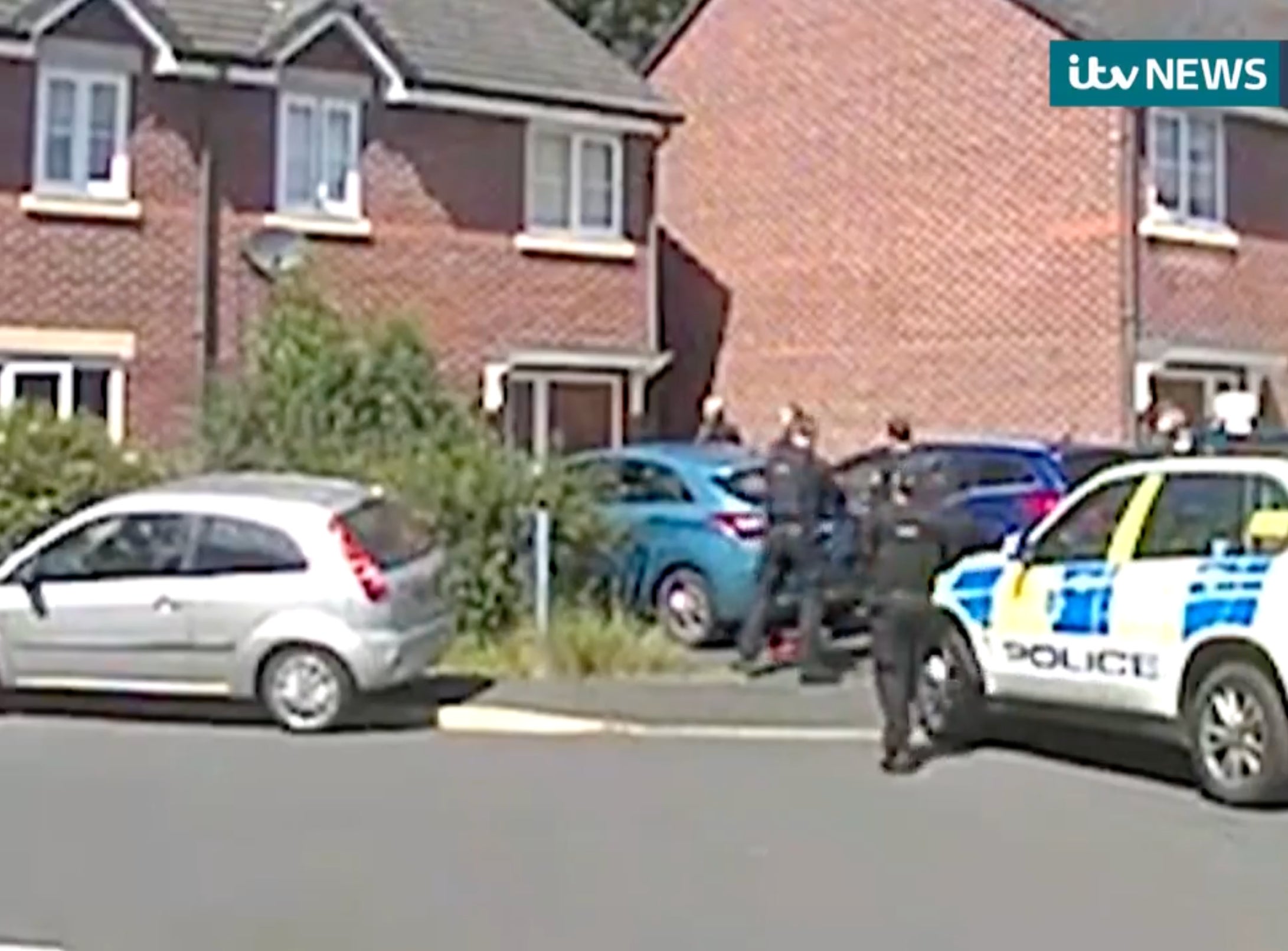 Police were later seen raiding the home the person has been seen outside