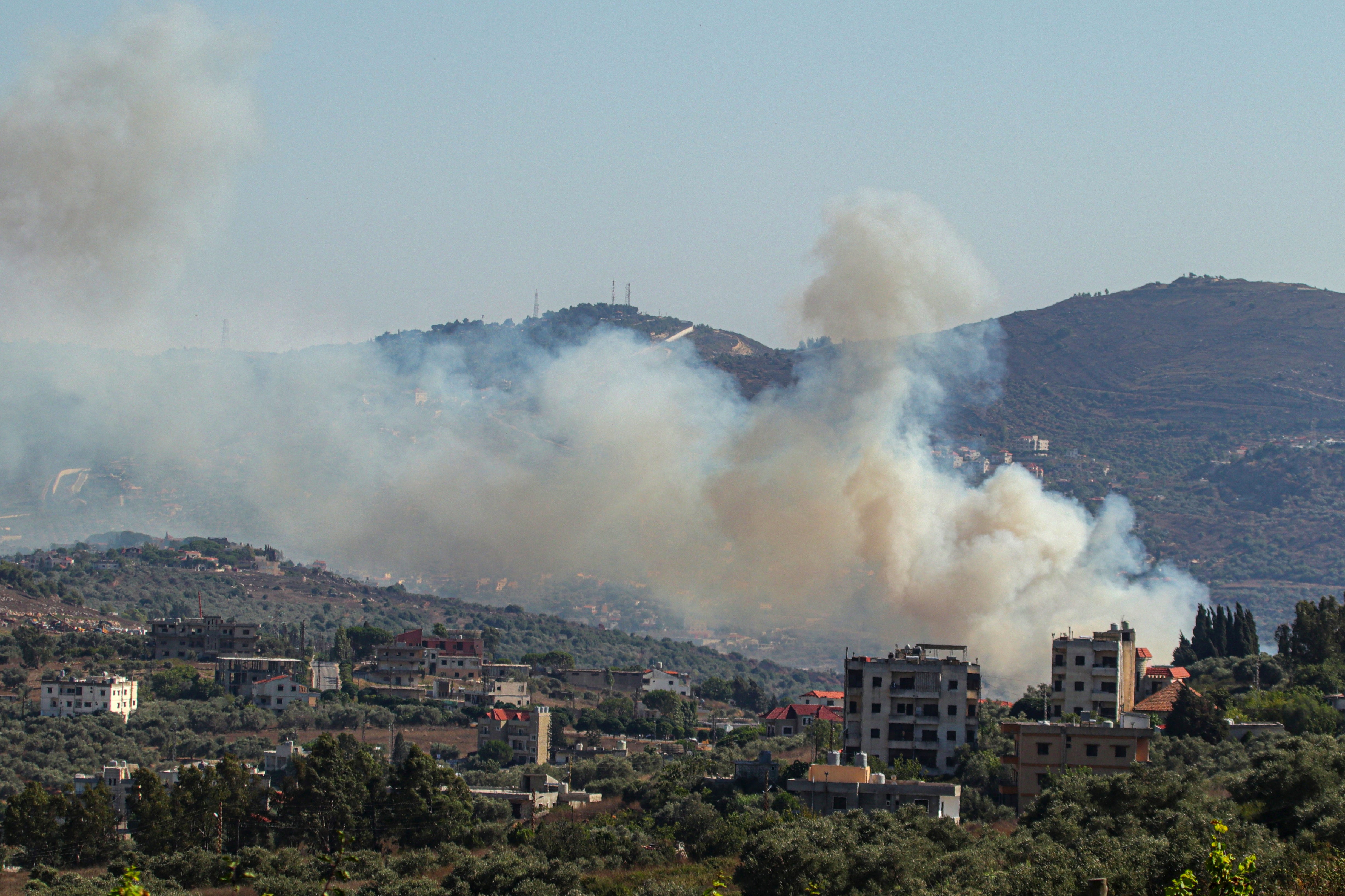 Smoke billowed from a site targeted by the Israeli military in the Lebanese border village of Kafr Kila on Monday