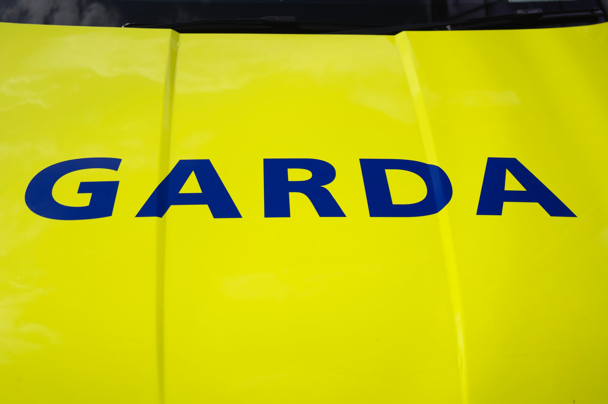 Close up of garda sign on vehicle hood