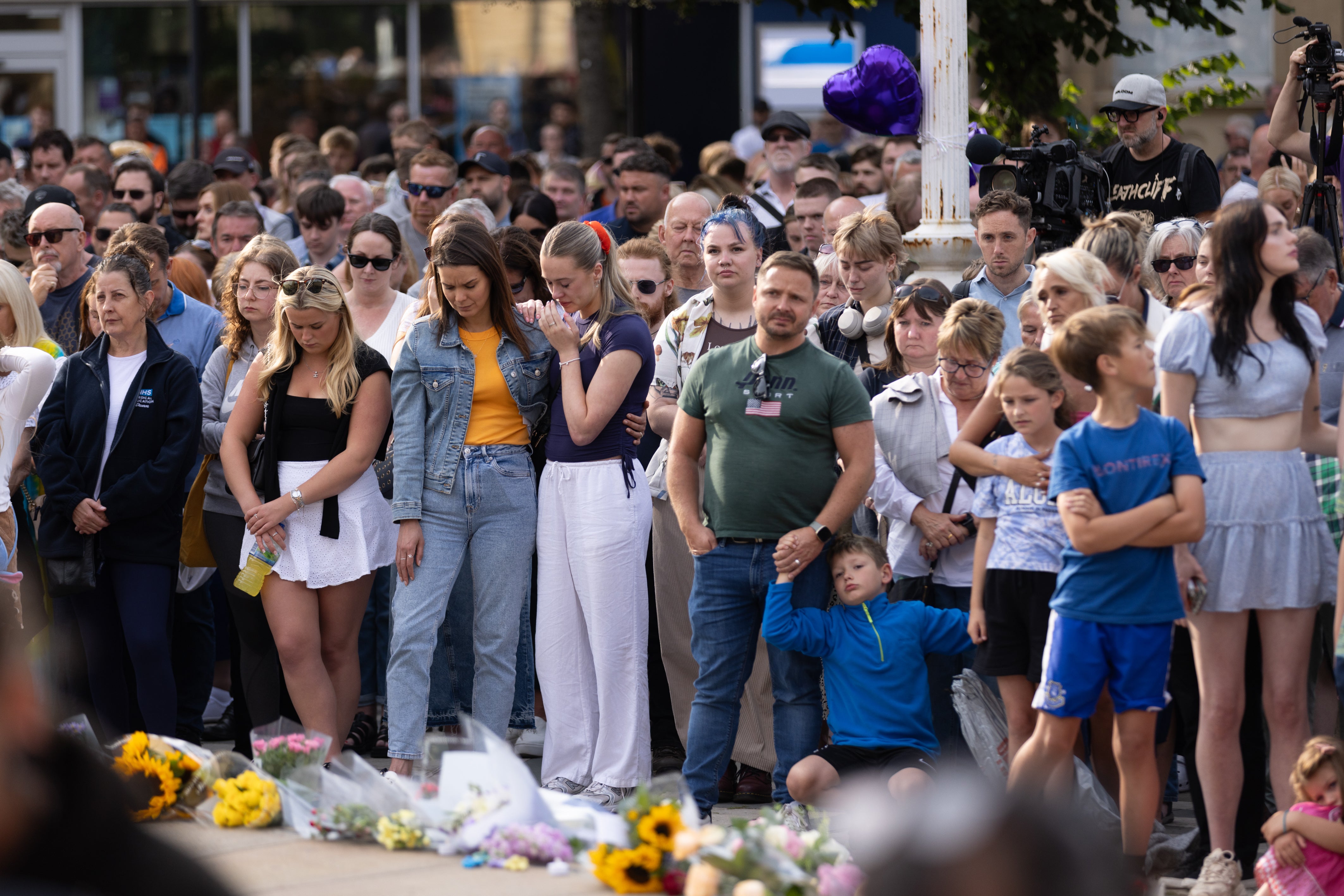 Crowds fought back tears during a vigil on Tuesday evening, before disorder later broke out