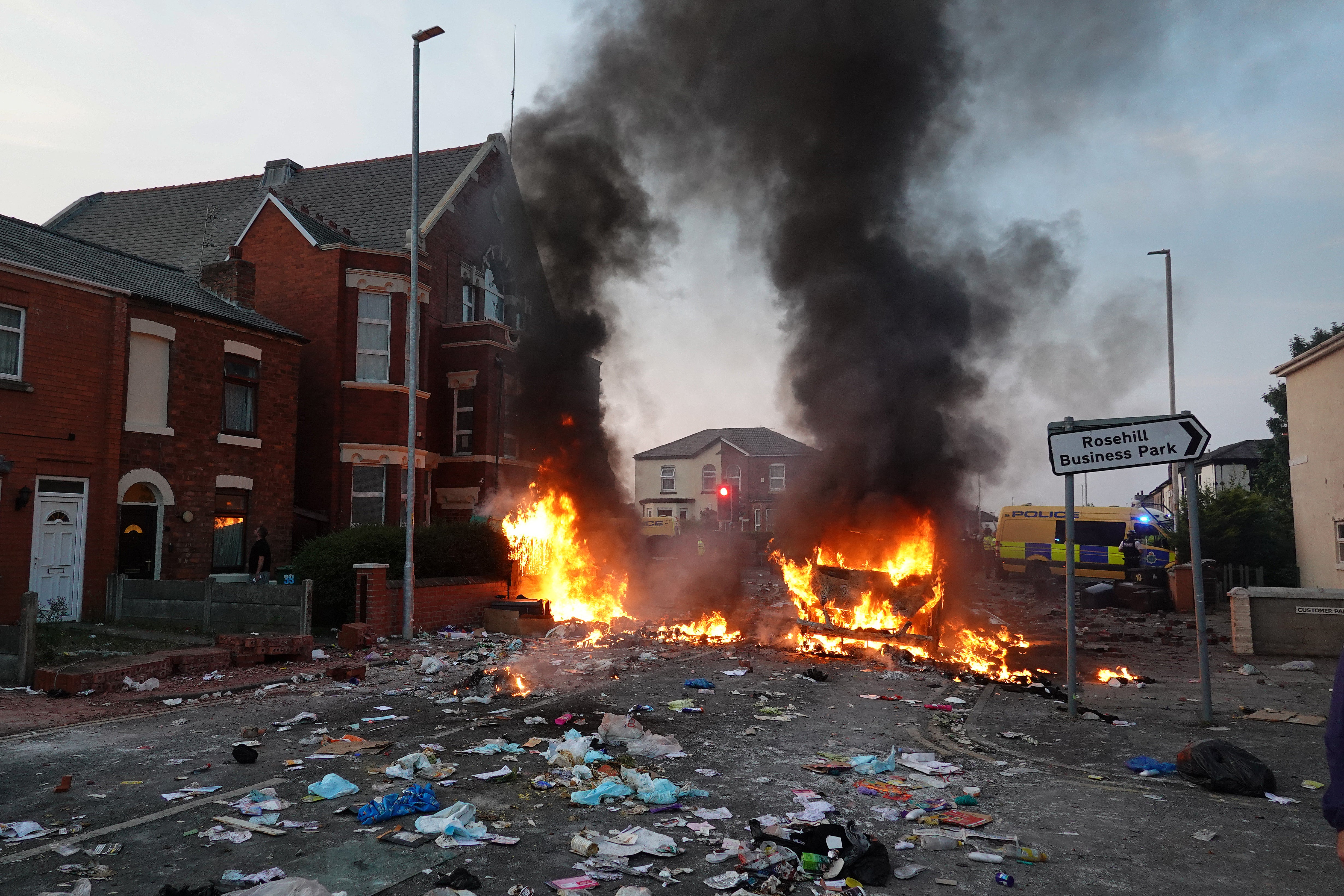 Protesters set fire to rubbish on the streets in Southport