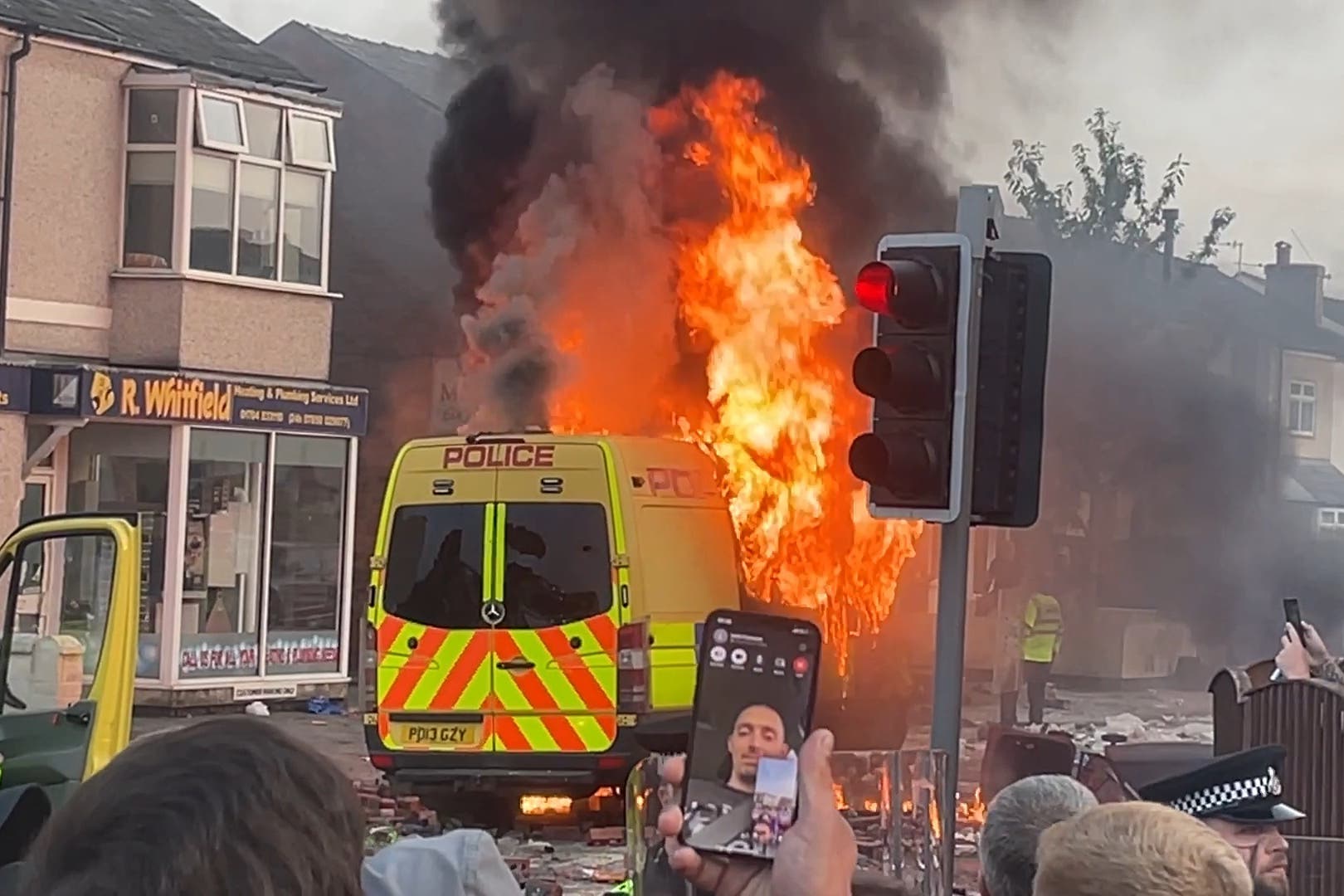 Police officers suffered serious injuries when bricks, stones and bottles were thrown and cars were set alight during violent protests