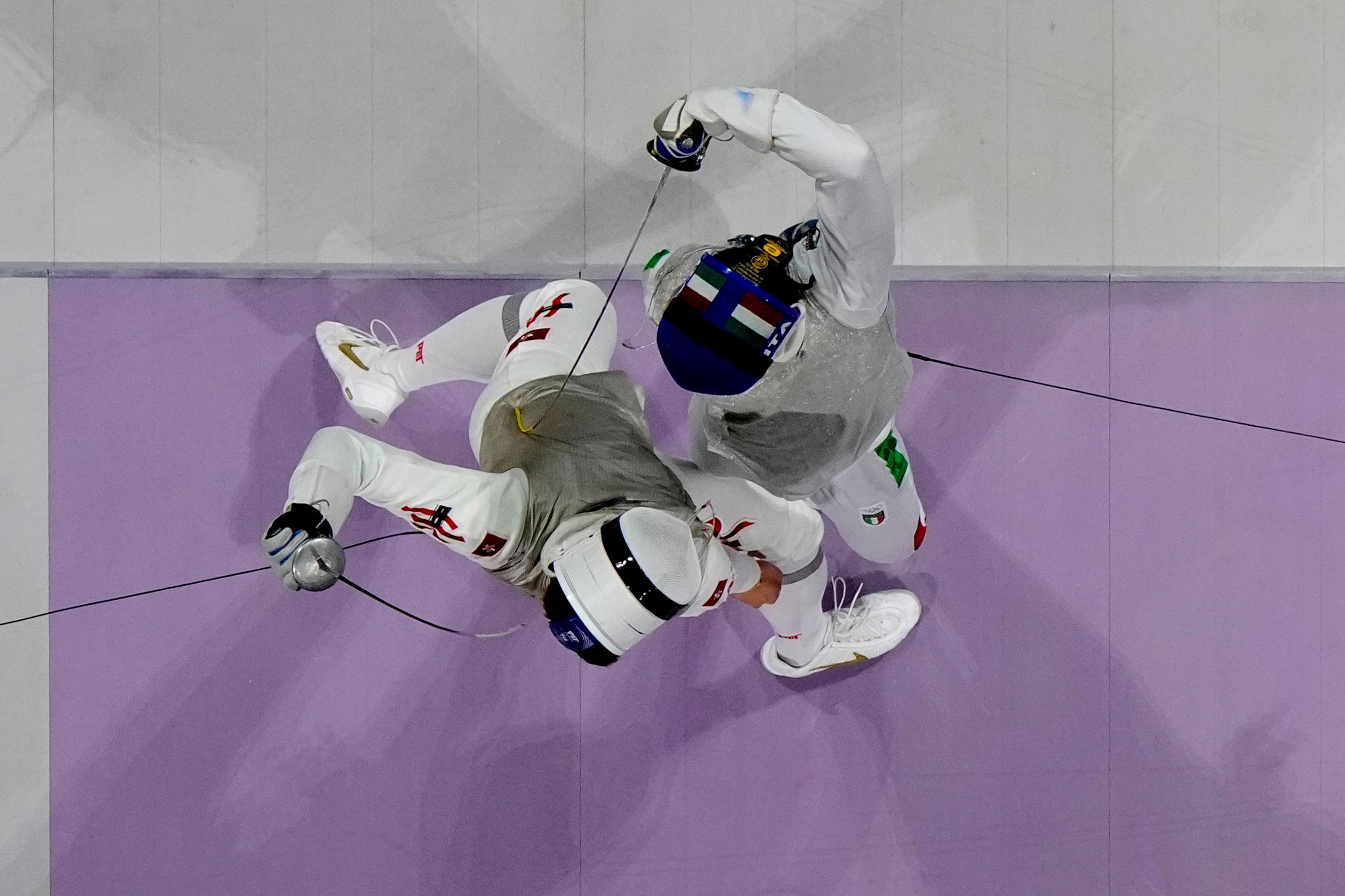 Hong Kong’s Cheung Ka long, left, competes with Italy’s Filippo Macchi in the men’s individual Foil final match